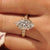 Vintage marquise diamond ring with engraved floral band.
