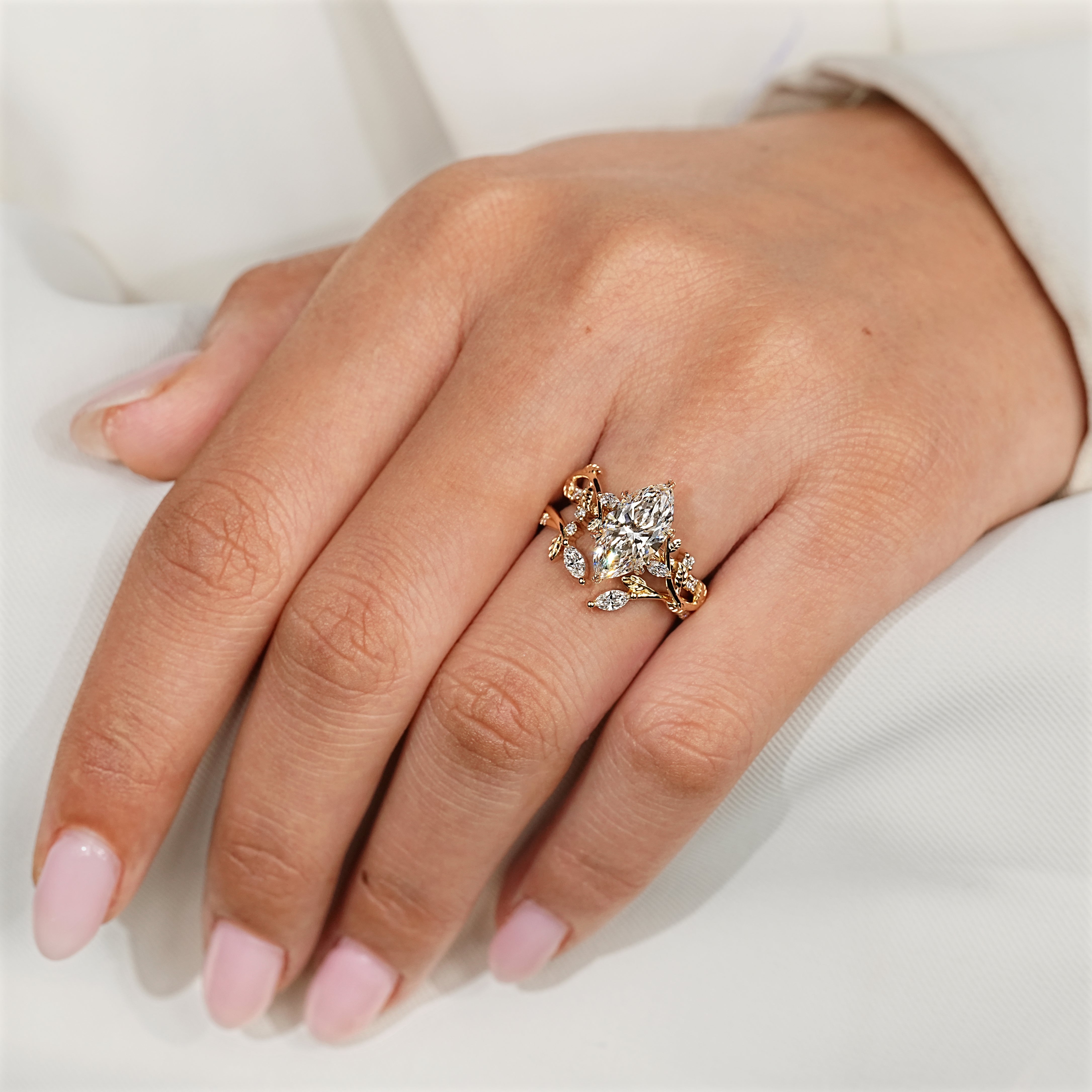 Leaf style prong on marquise engagement ring
