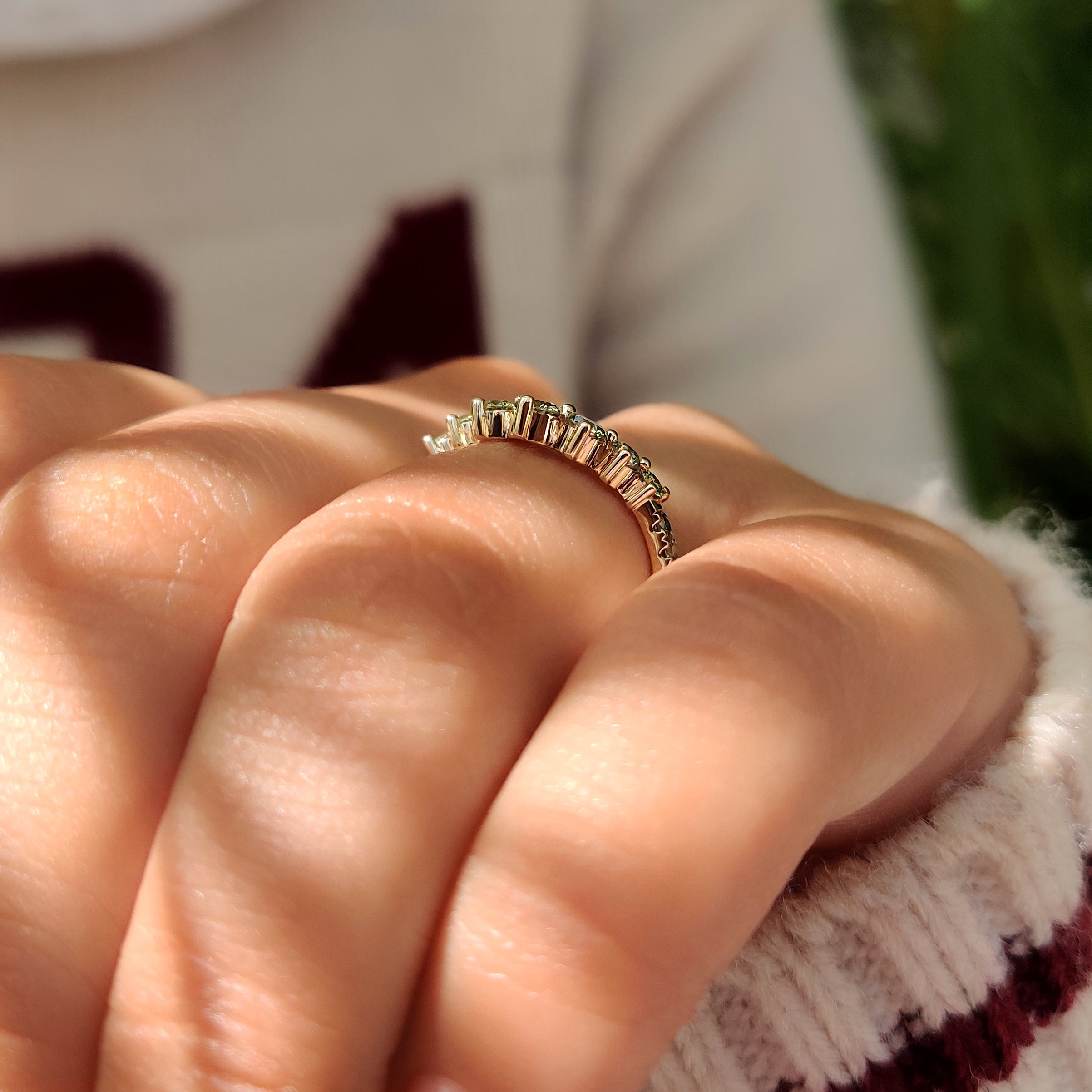 Shared prong wedding band with green round diamond details

