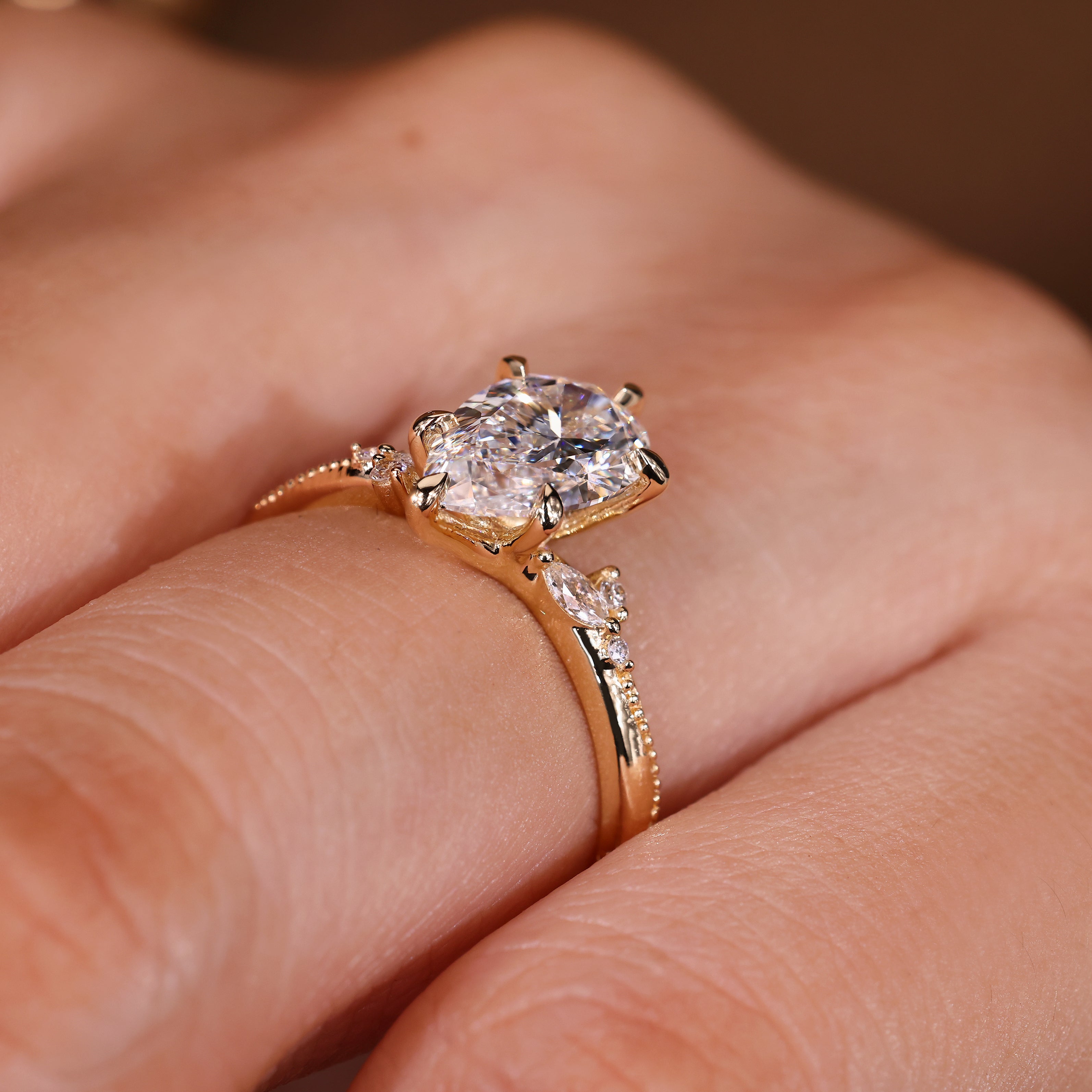 Handmade pear engagement ring with marquise side stones
