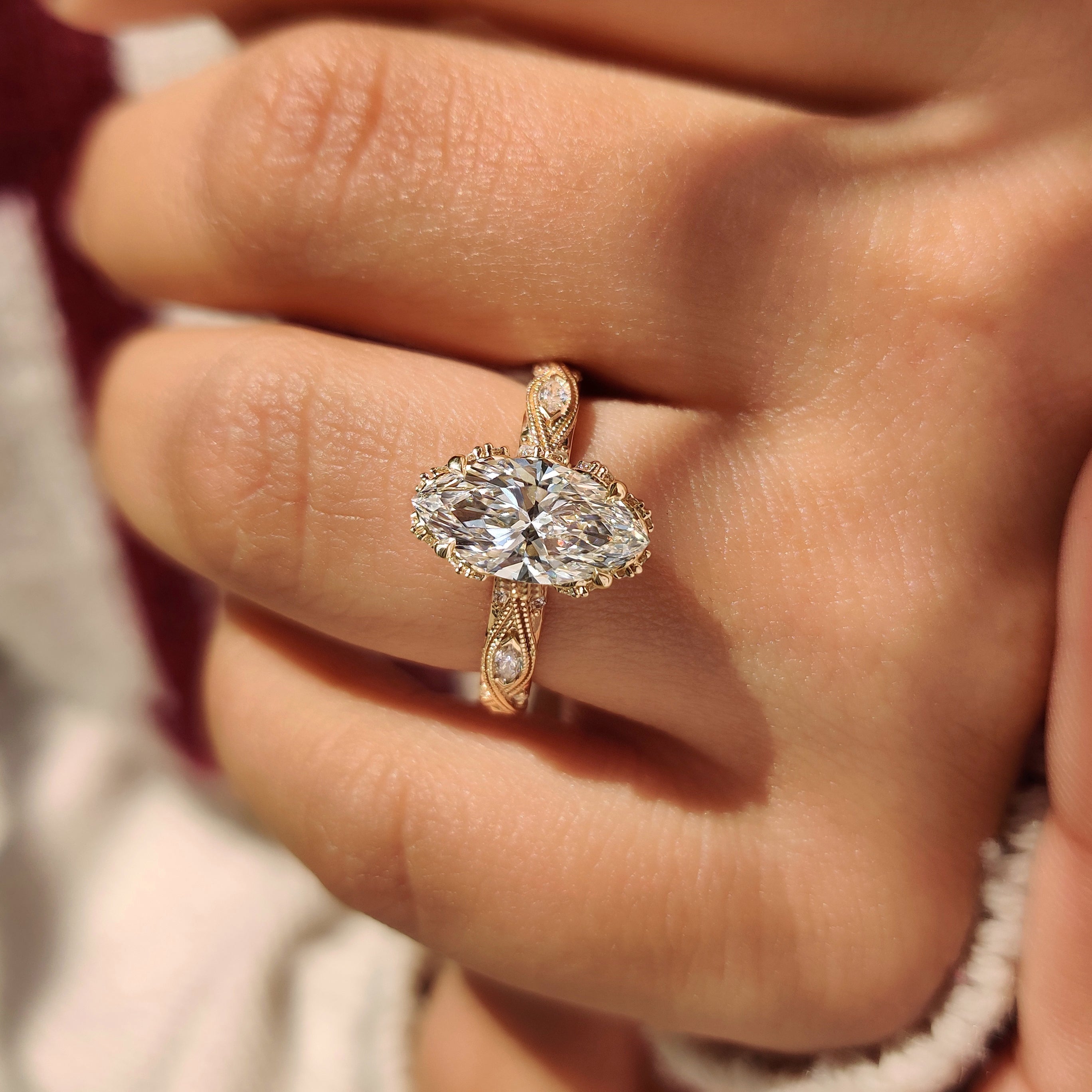Marquise diamond ring with hidden flower crown detail.
