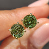 Portuguese cut green diamond stud earrings with four prongs
