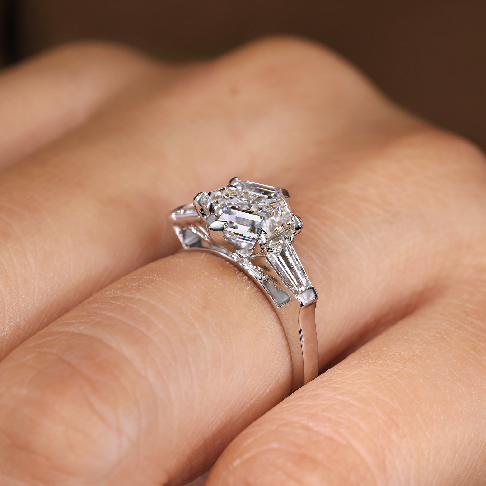 Lab grown hexagon diamond ring with baguette side stones.
