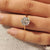 Solitaire hexagon diamond ring with tulip style setting details
