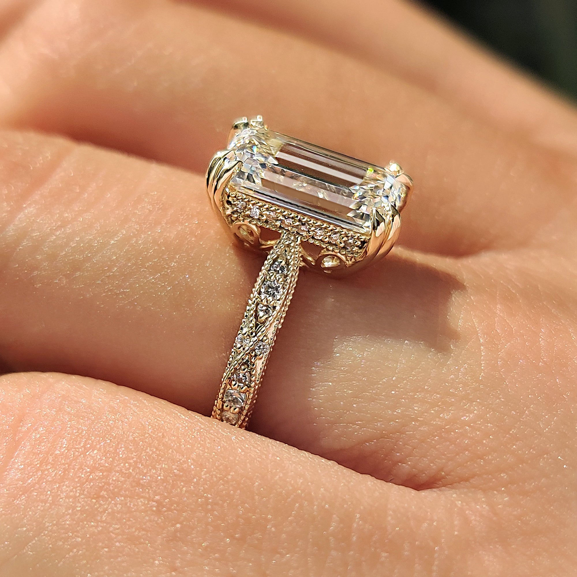 Round hidden halo emerald diamond ring.
