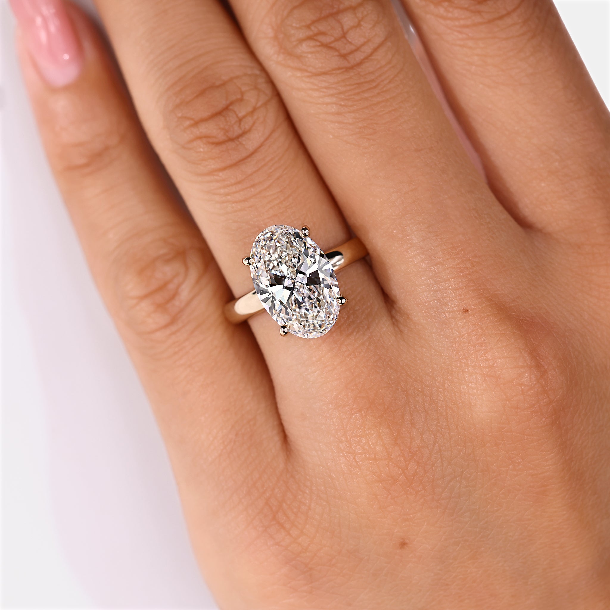Four prong hidden halo engagement ring design
