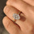 Art Deco oval diamond ring with cathedral setting style.

