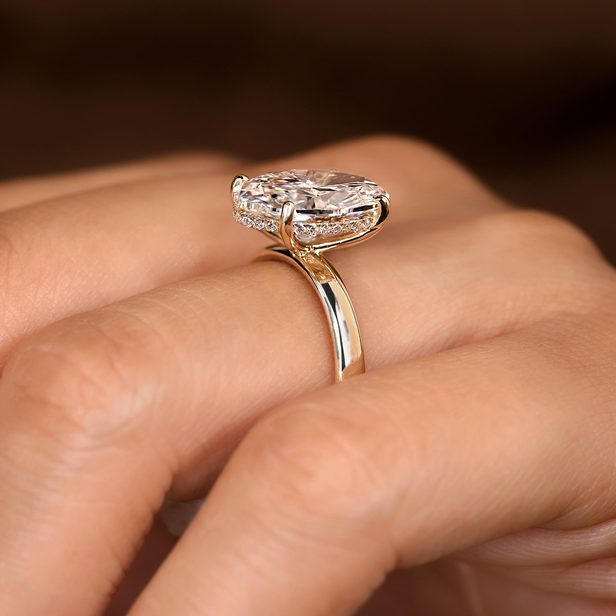 Hidden halo engagement ring with four prong setting
