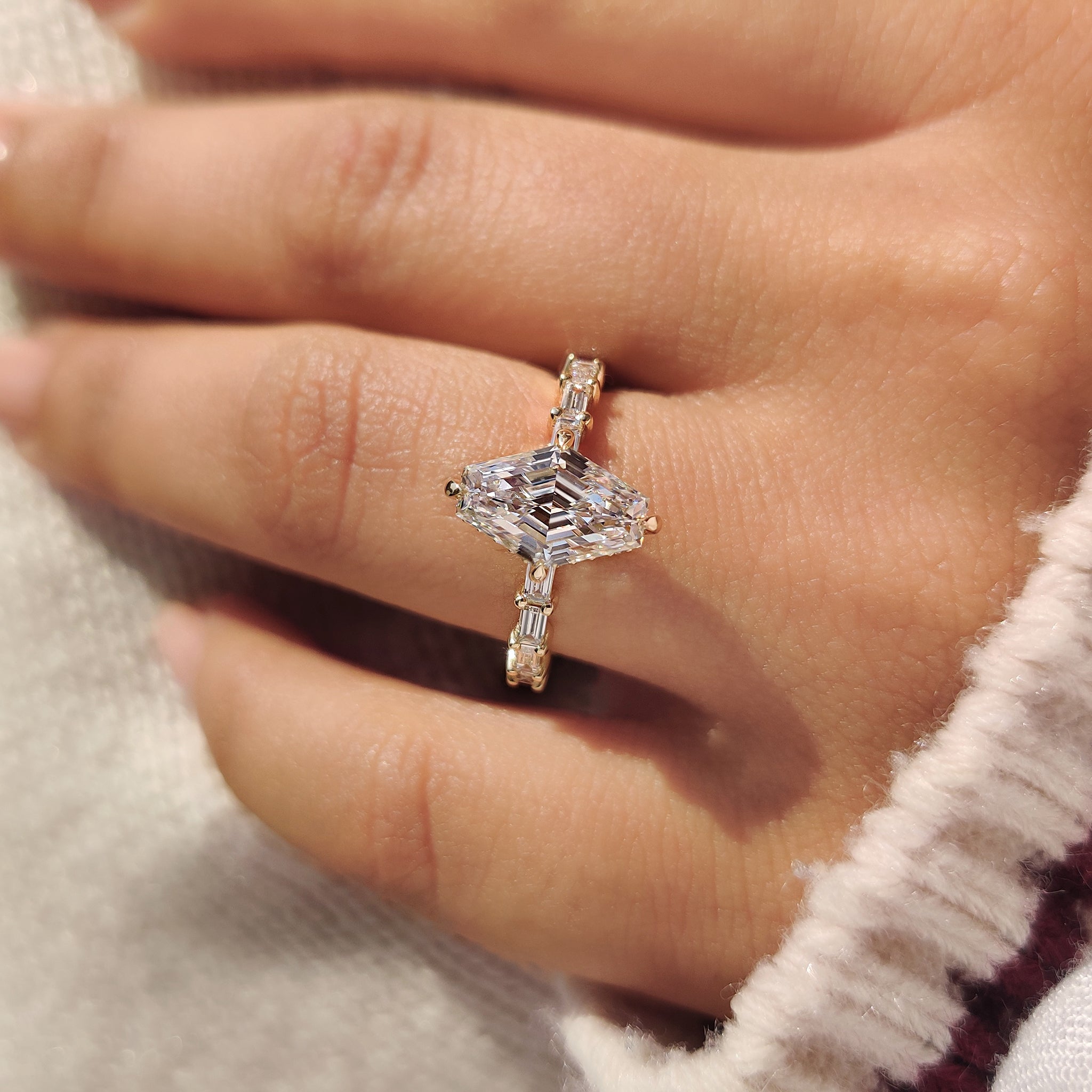 Compass claw prong hexagon diamond ring with pave band.
