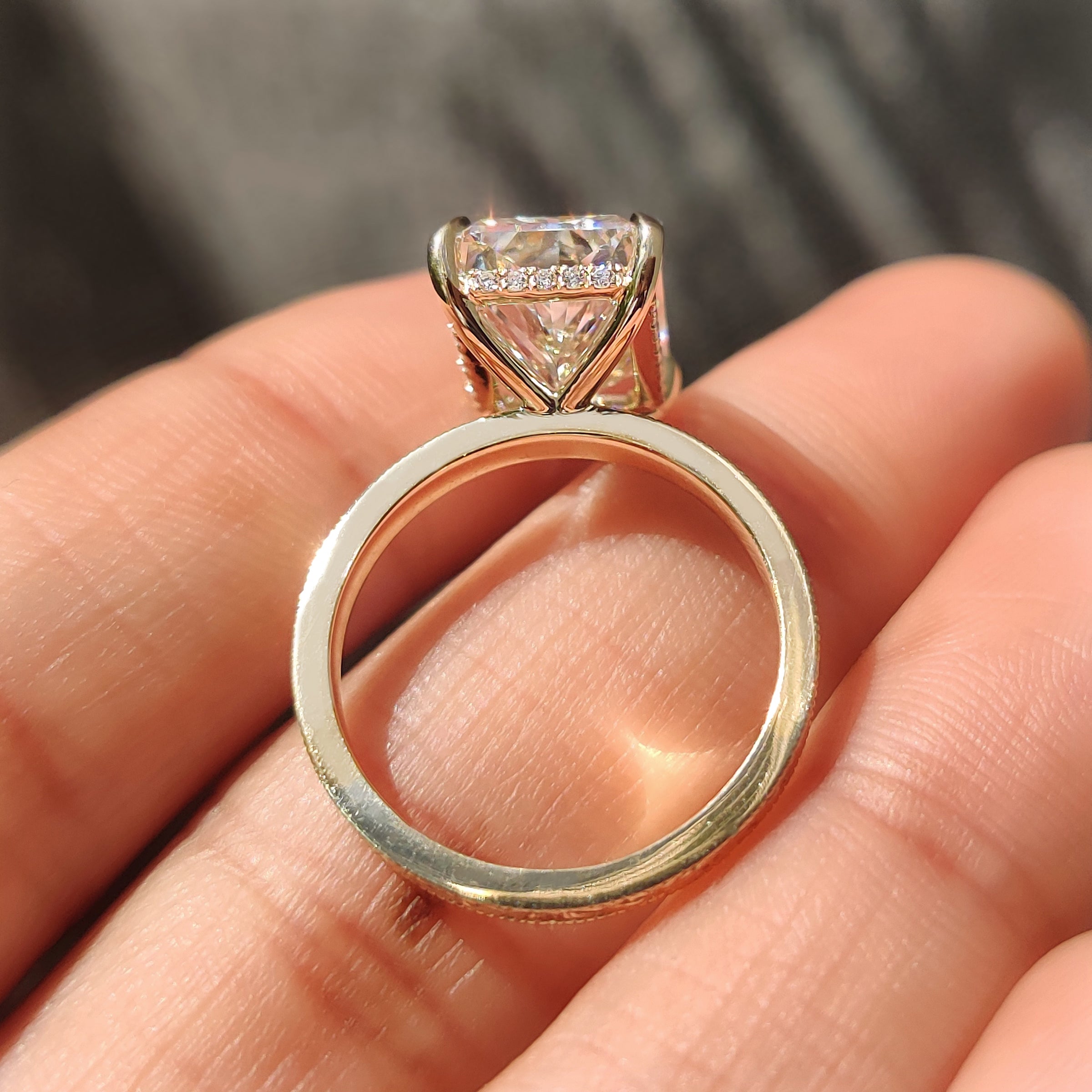 5 carat radiant diamond with four claw prong setting.
