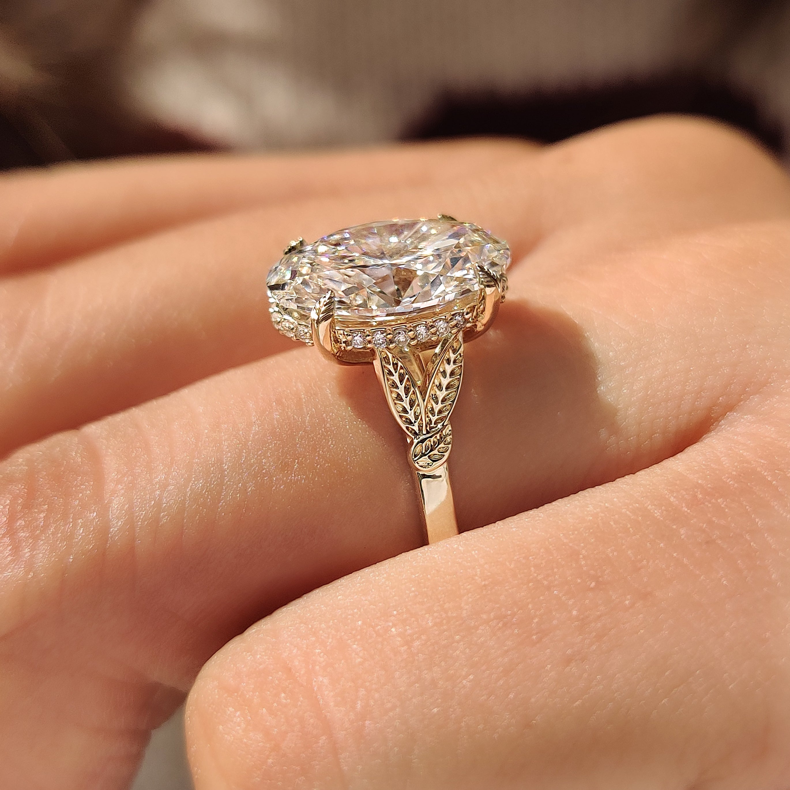 Leaf style split shank oval engagement ring
