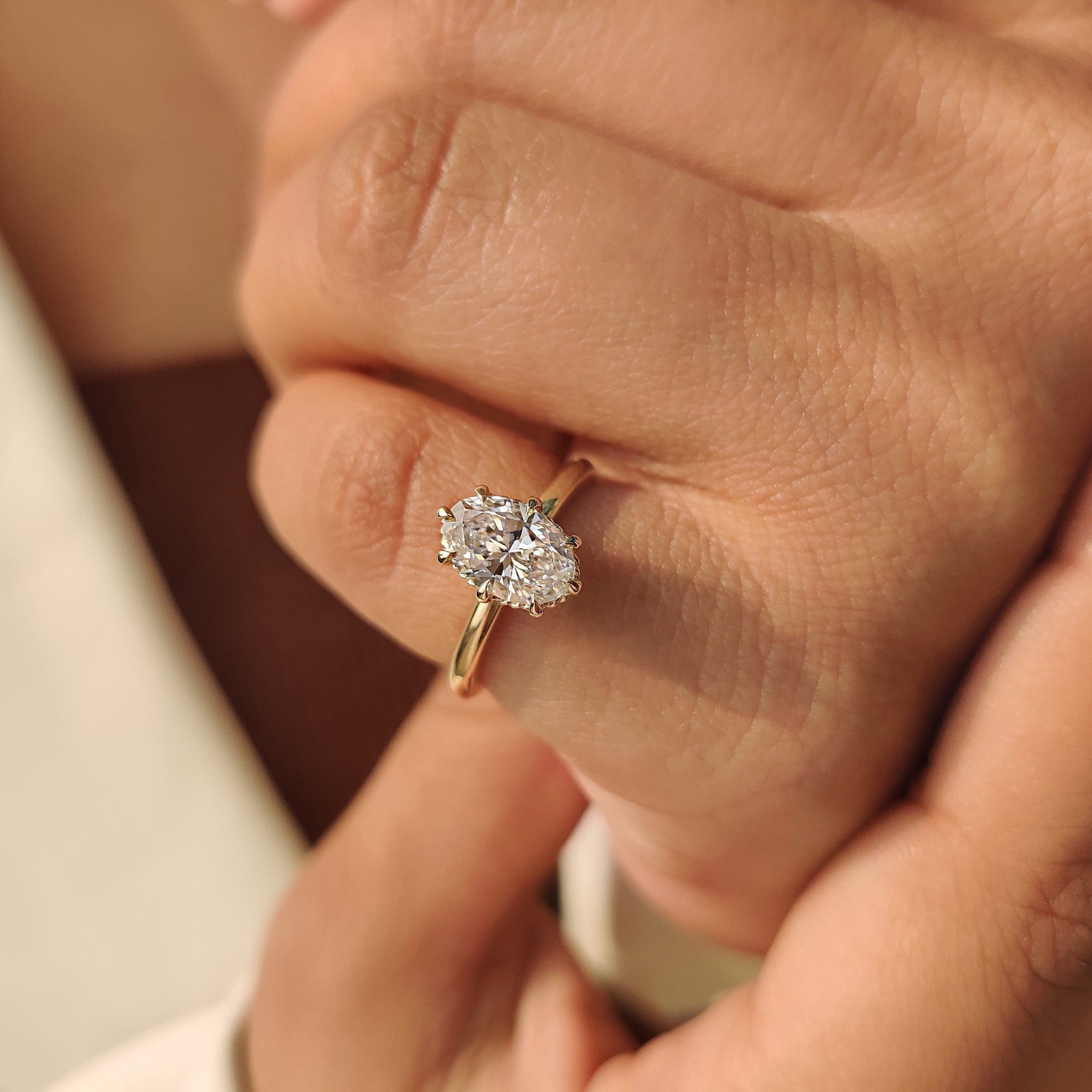 Oval engagement ring showcasing solitaire lab grown diamond
