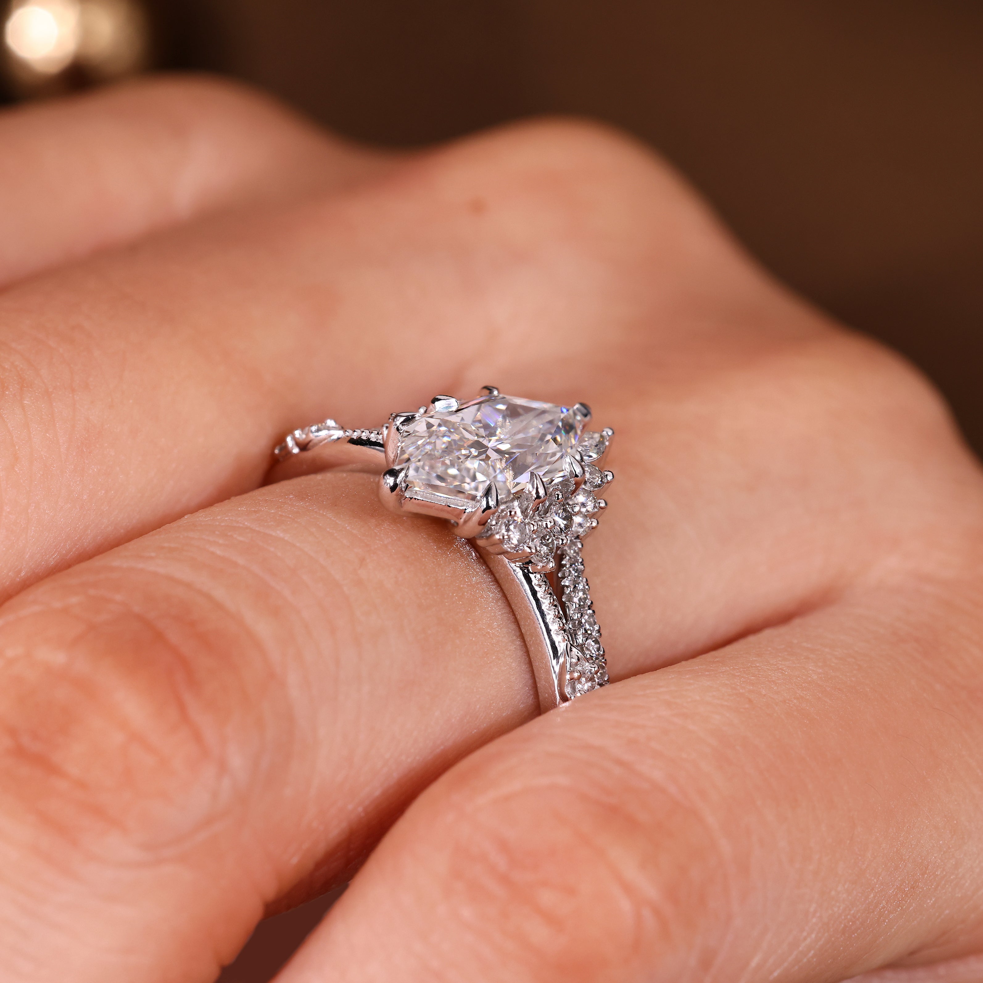 Curved wedding band with pear and round diamond accents
