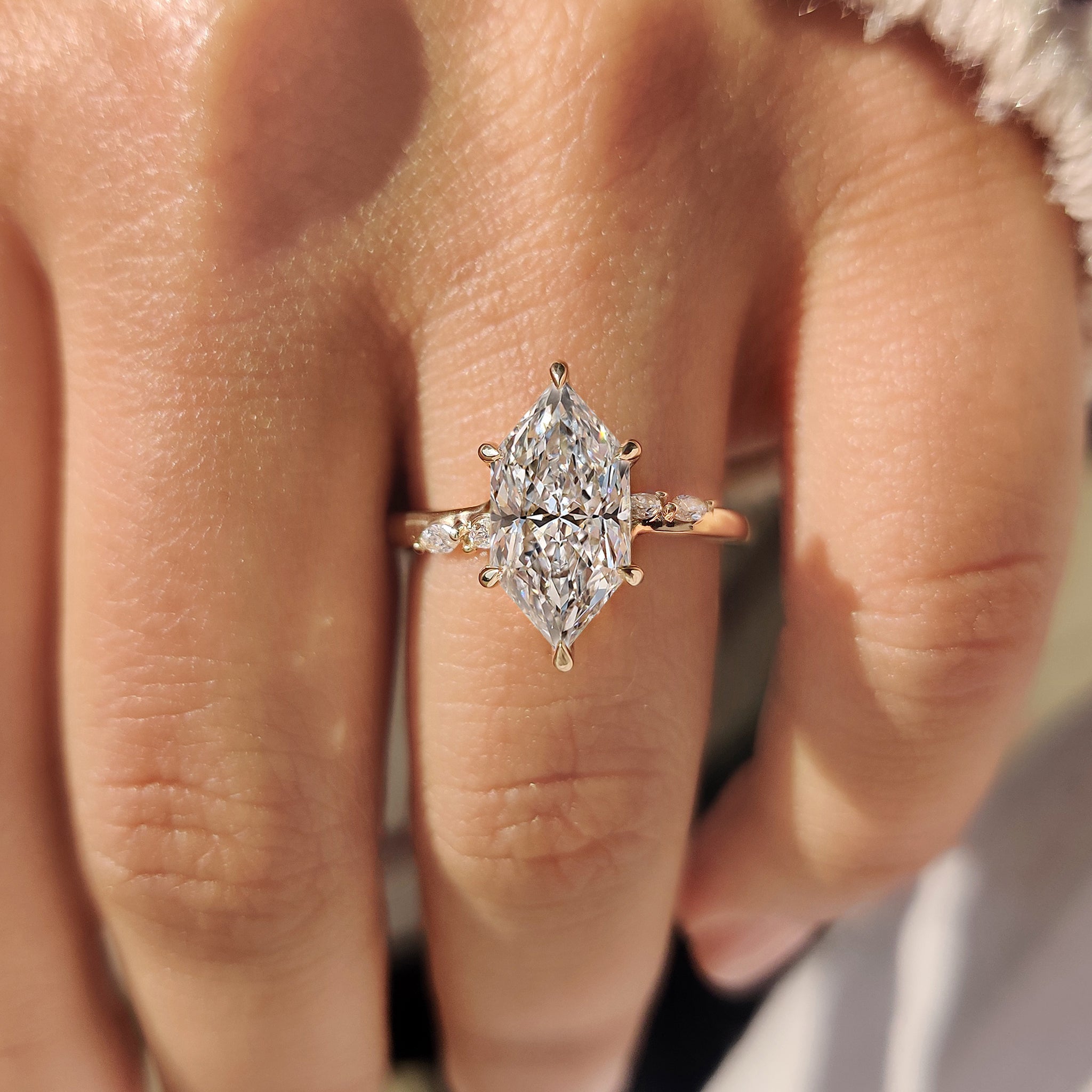 Dutch marquise diamond ring with elegant side stones.
