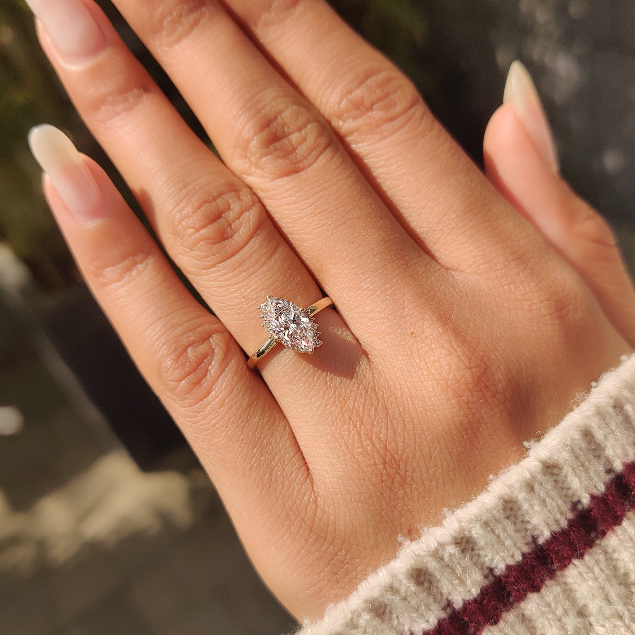 Marquise cut lab grown diamond ring with milgrain edge.
