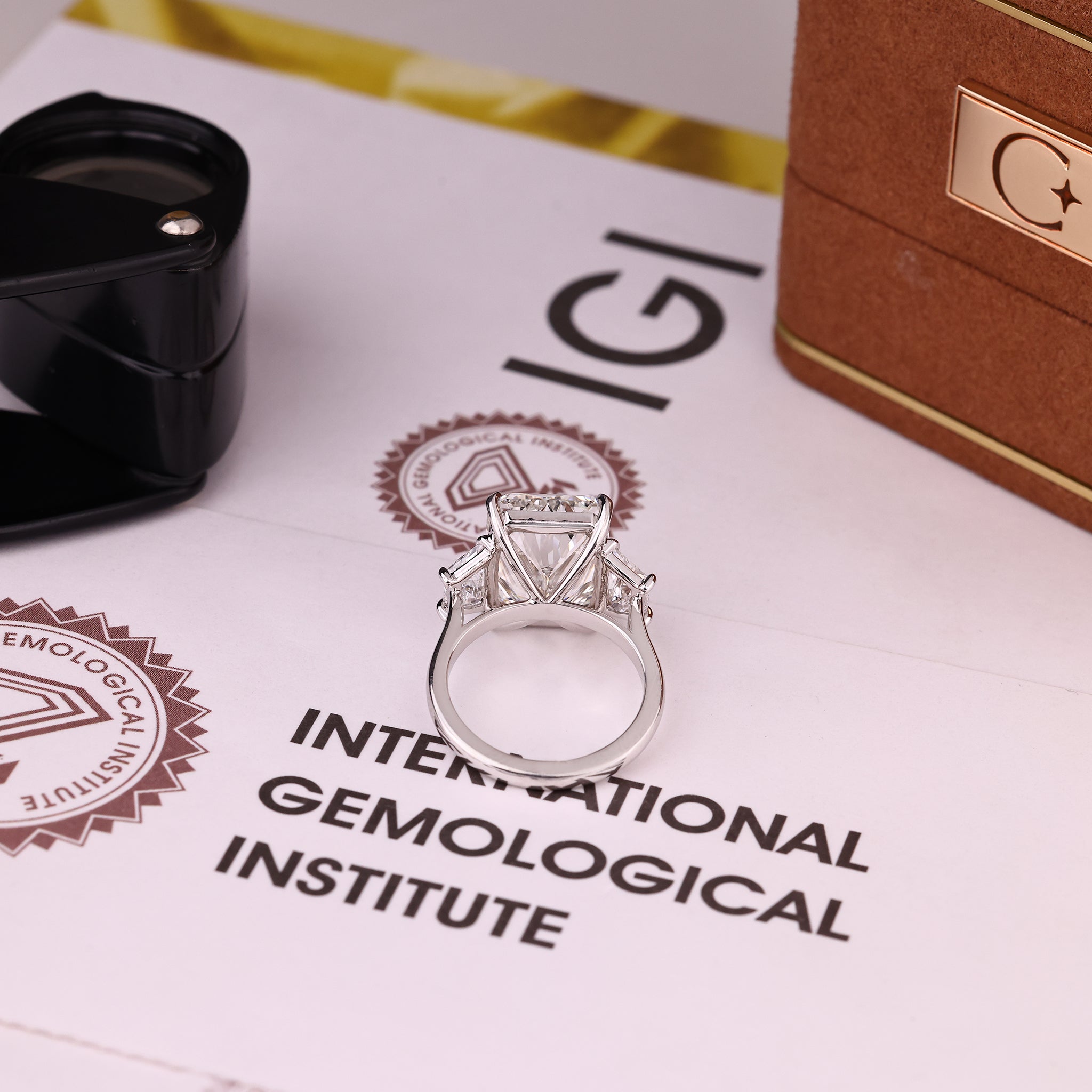 IGI certified radiant cut diamond ring with three stone style.
