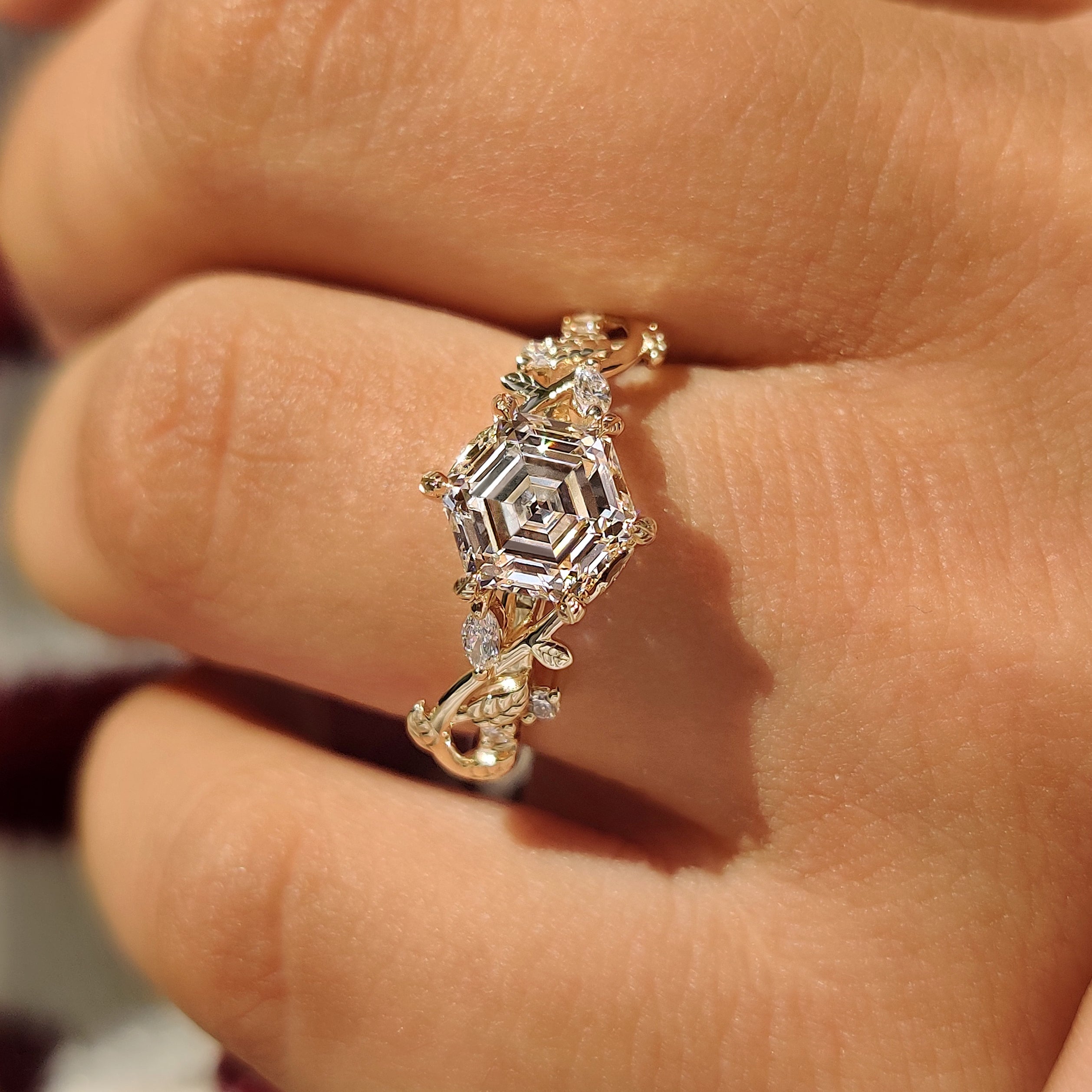Hexagon diamond ring with leaf details and cluster setting
