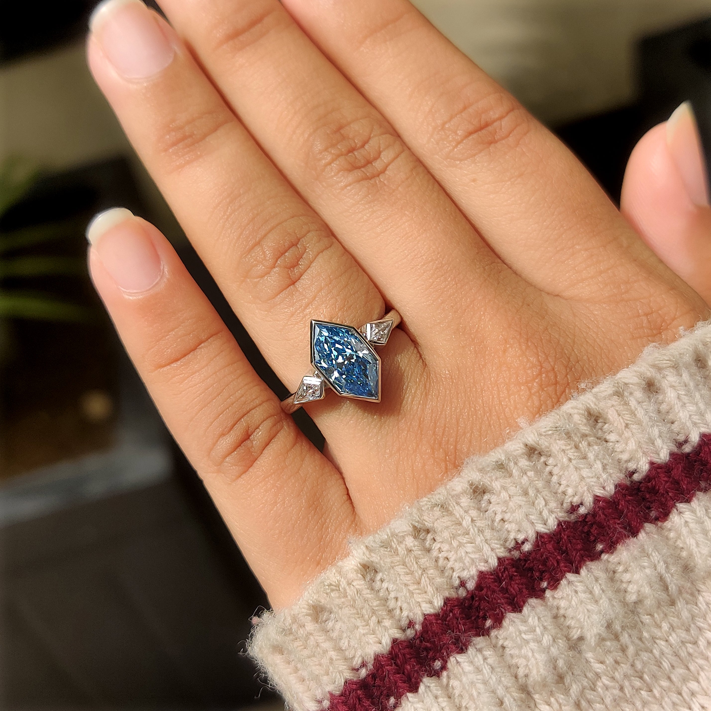 Handmade ring with blue dutch marquise center diamond and kite side stones

