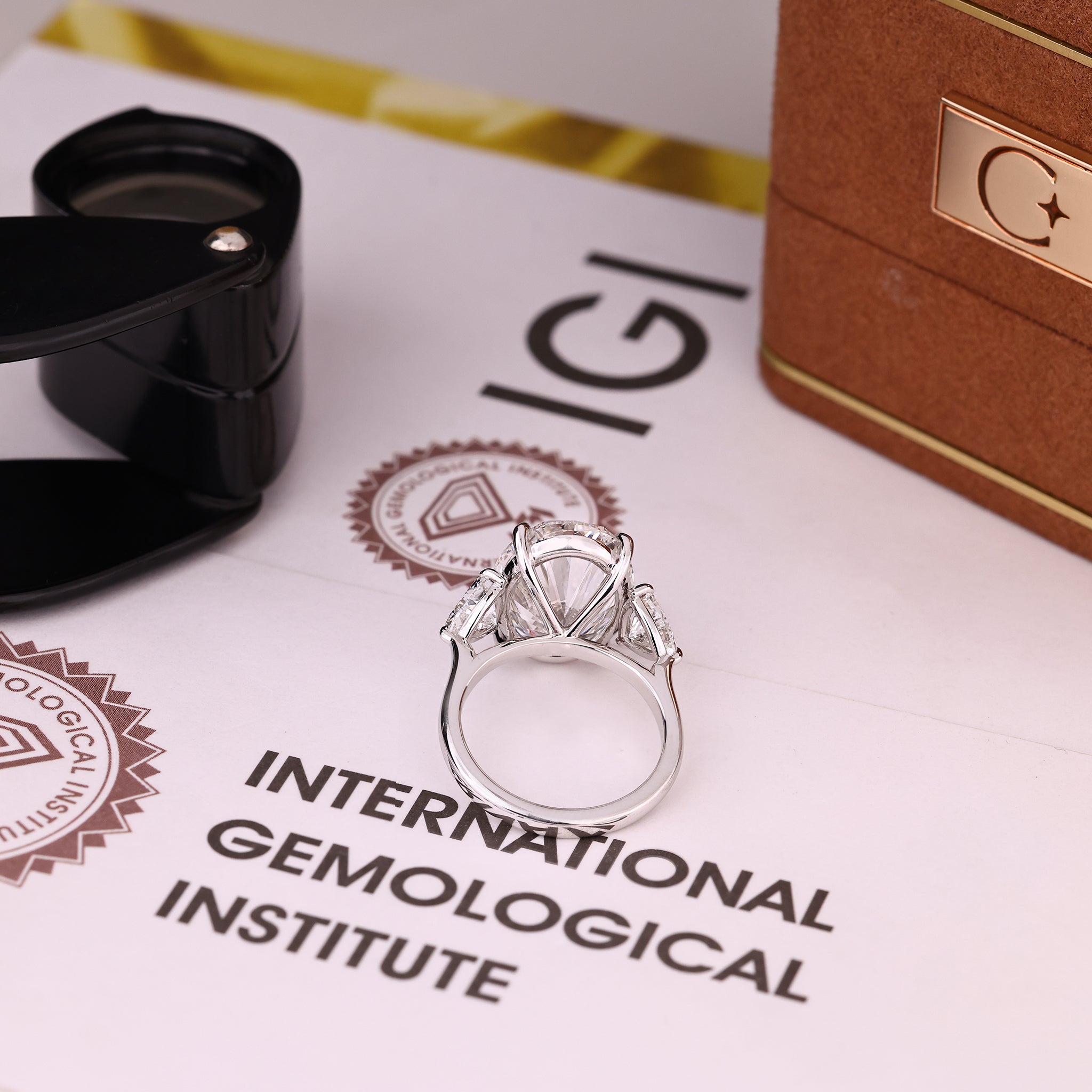 IGI Certified 10 -15 Carat Oval Diamond Ring in Three Stone Style