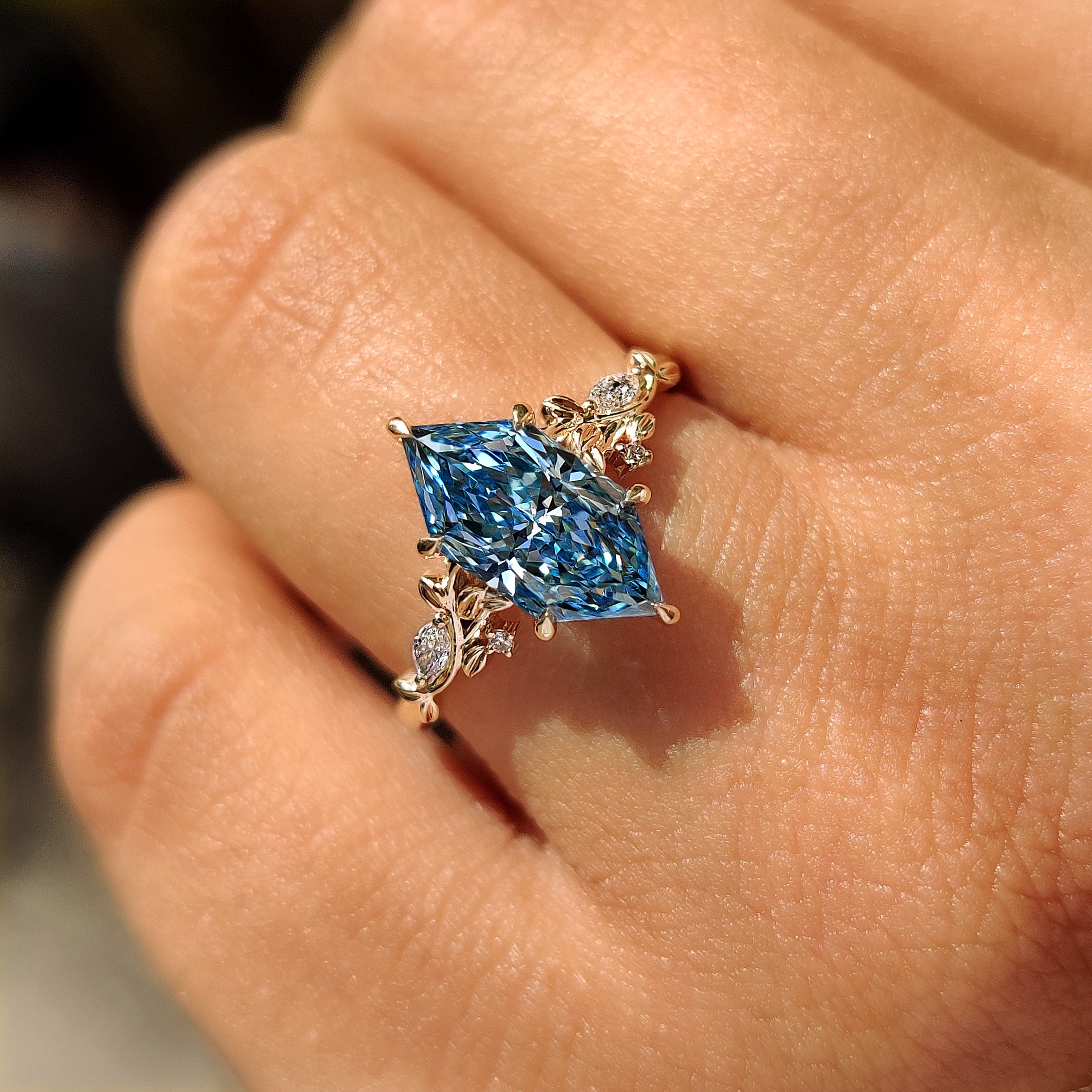 Carat diamond ring with blue marquise and side stones
