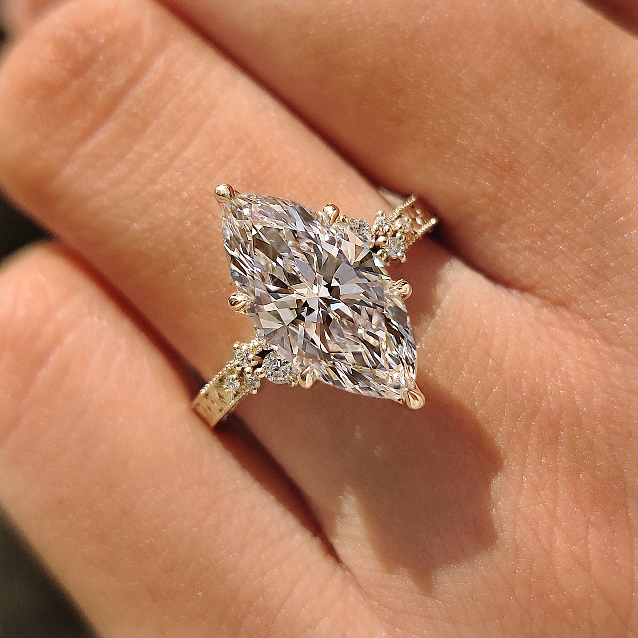 Marquise ring with tulip setting and six claw prongs
