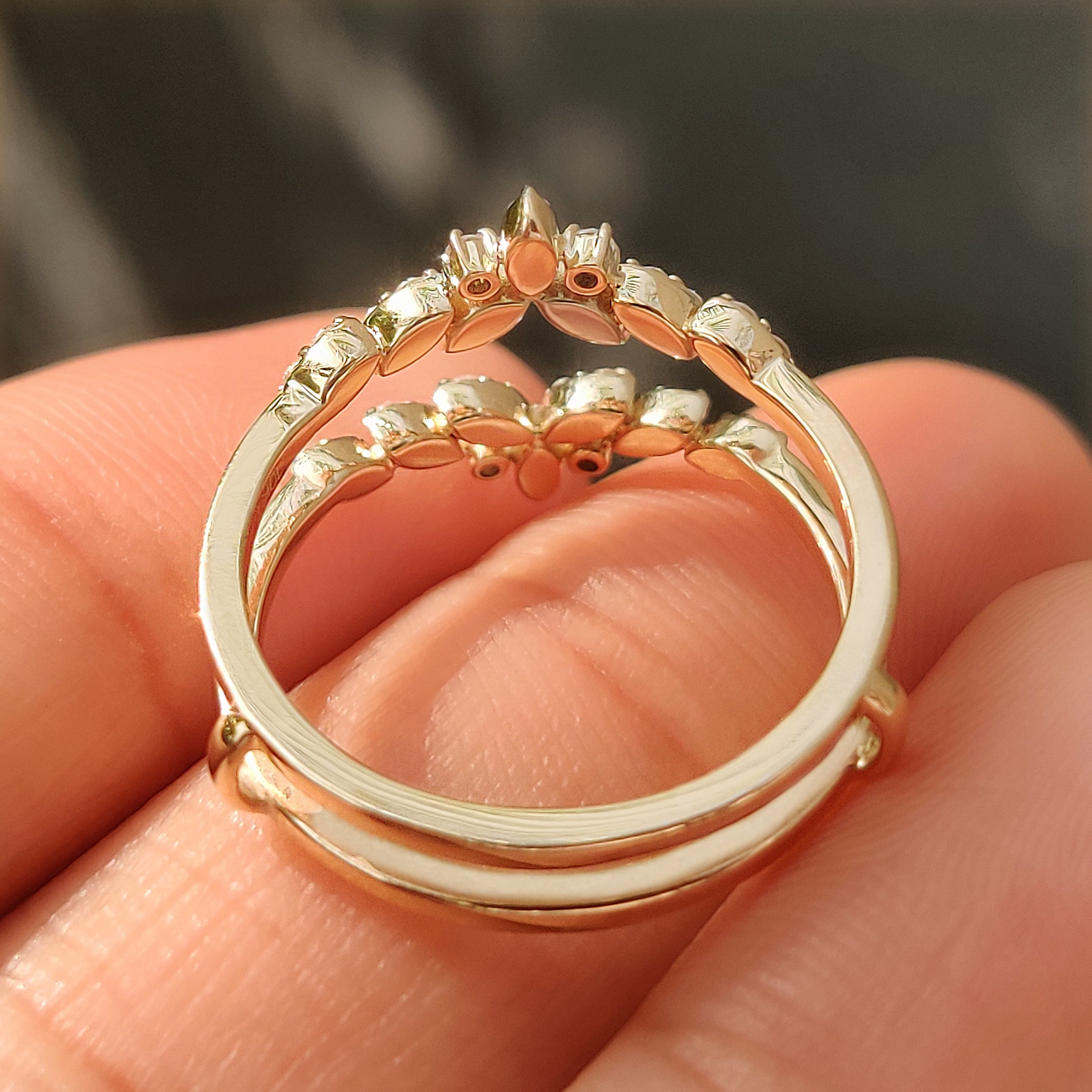 Lab grown round diamonds set in a yellow gold enhancer.