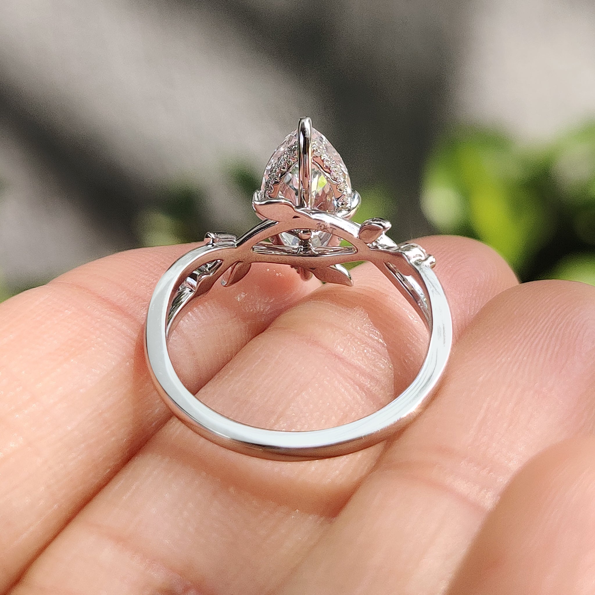 IGI certified marquise ring with nature inspired design.
