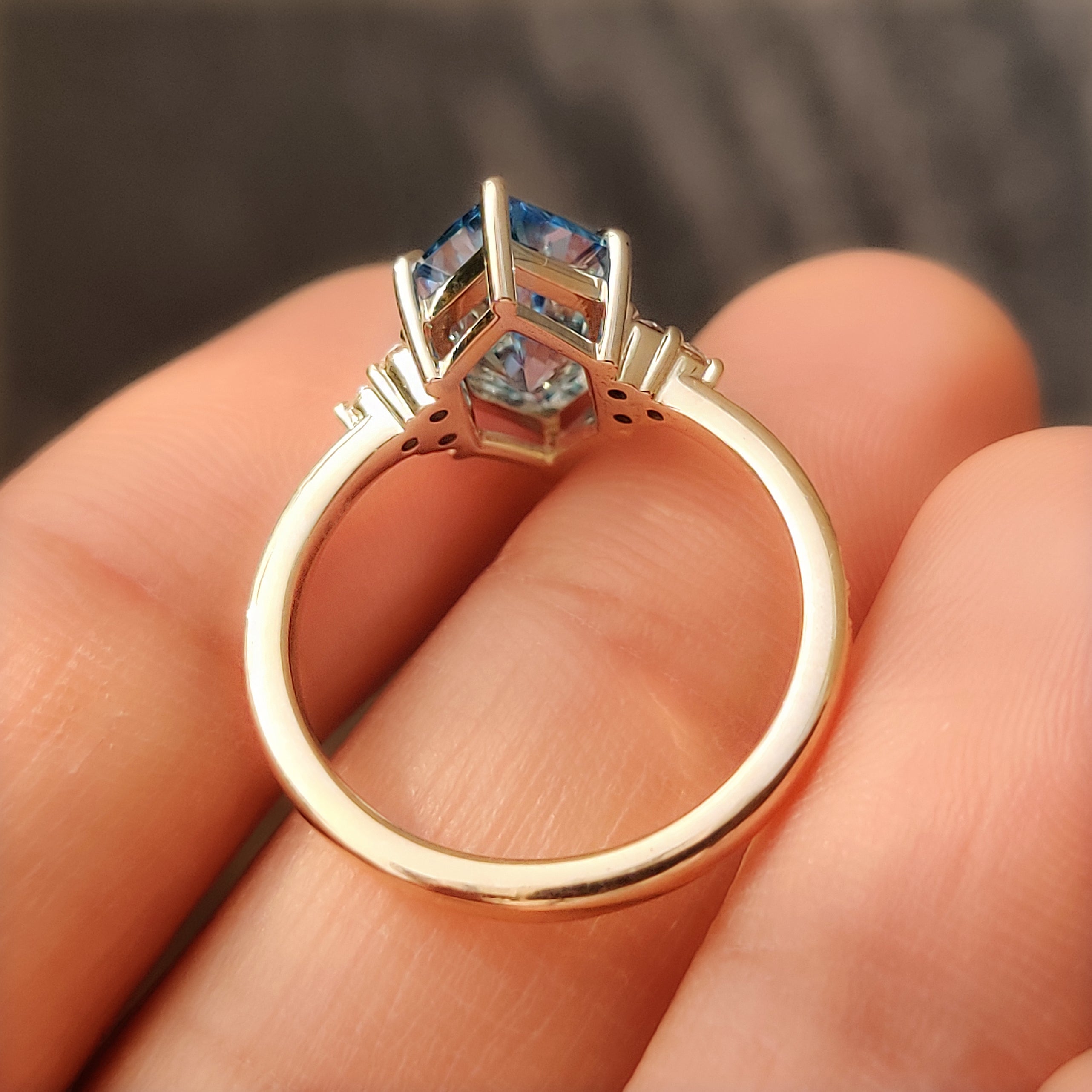 Diamond cluster ring with round cut pave diamonds on the band.
