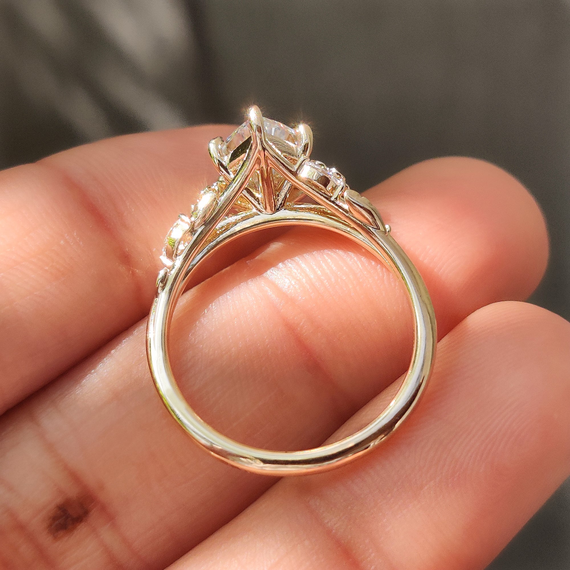 Round side stones paired with a Dutch marquise center diamond.
