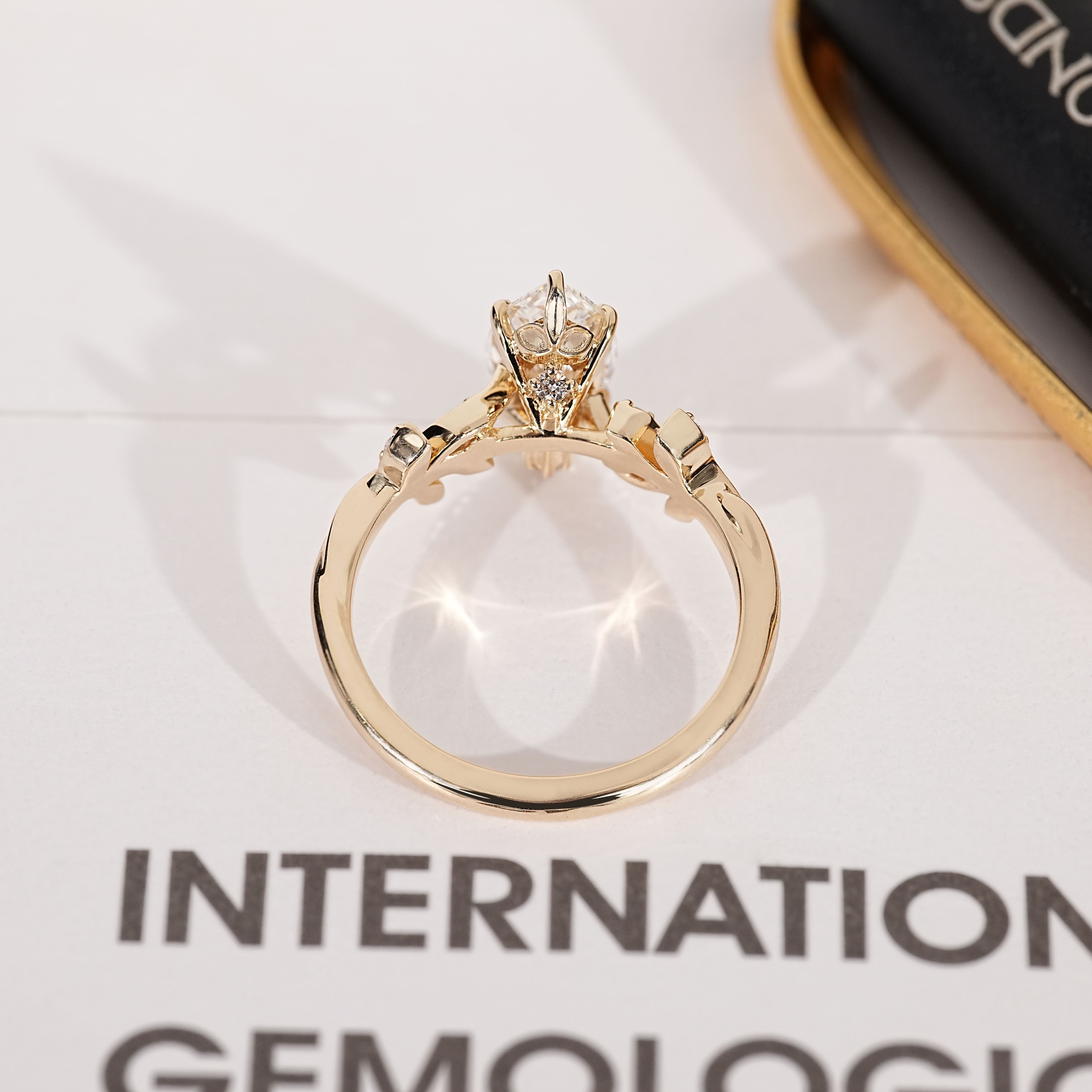 IGI certified marquise ring with leaf detailing.
