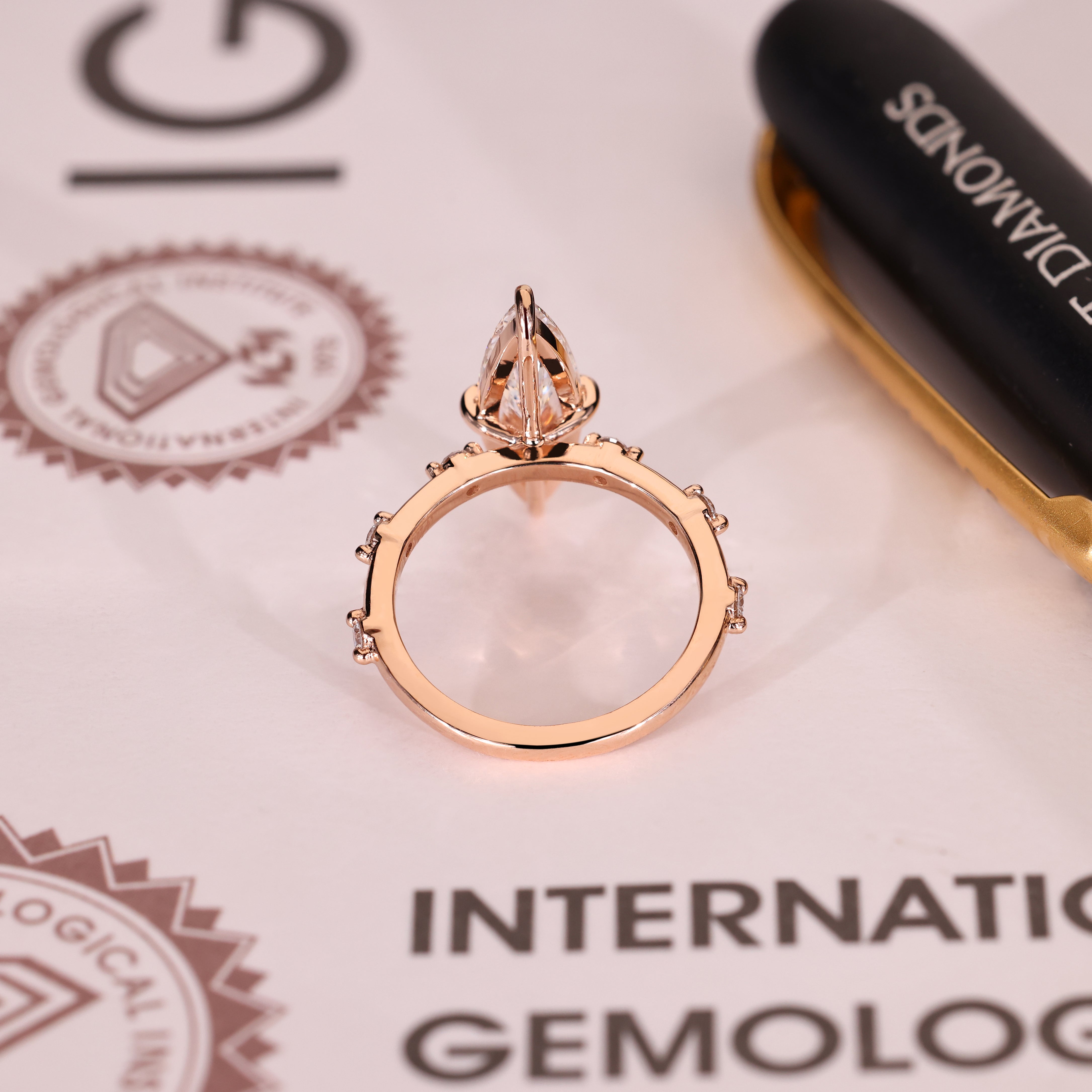 IGI certified marquise ring with round diamond accents
