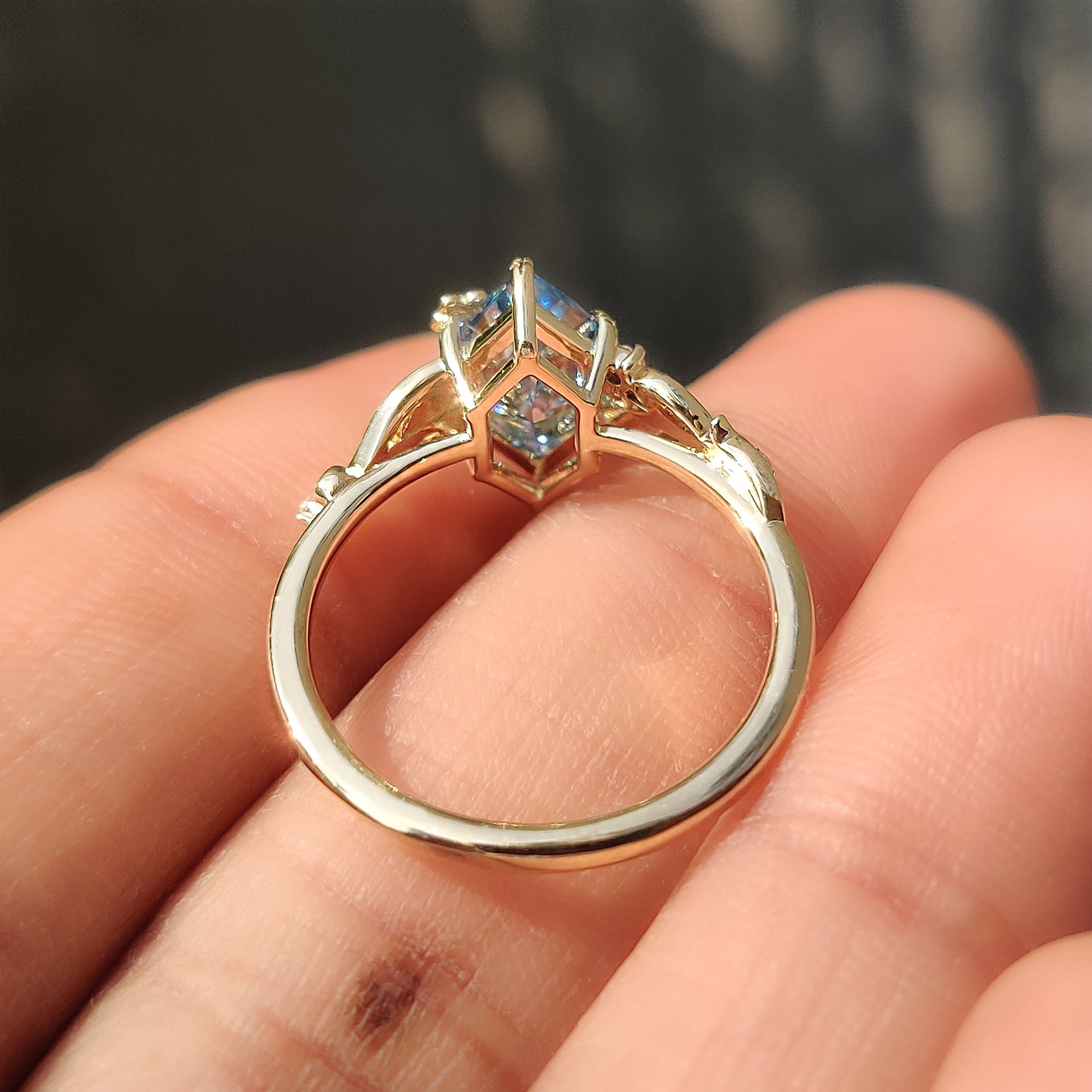 Leaf and vine design across the band of a Dutch marquise ring.

