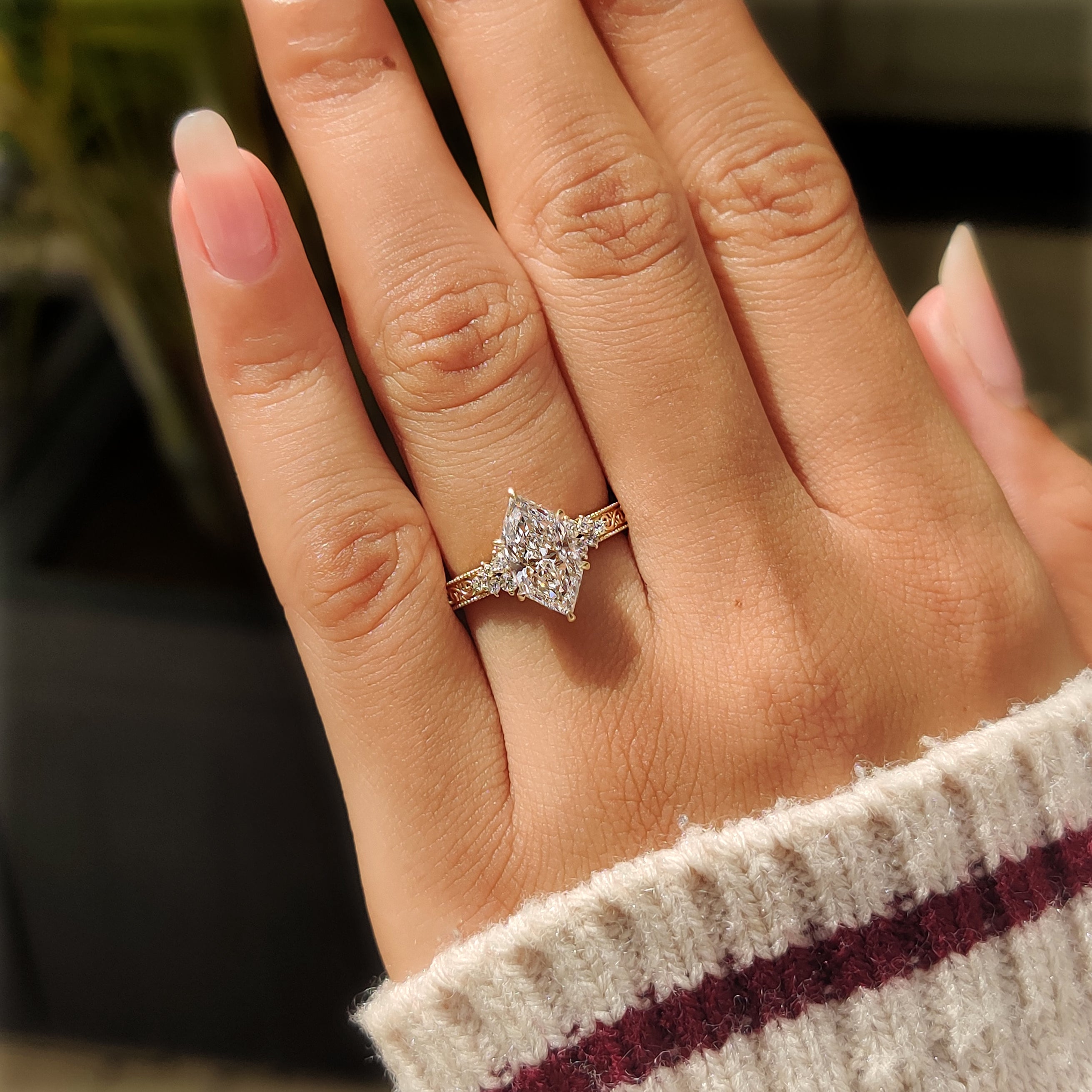 Milgrain engagement ring with Dutch marquise center diamond
