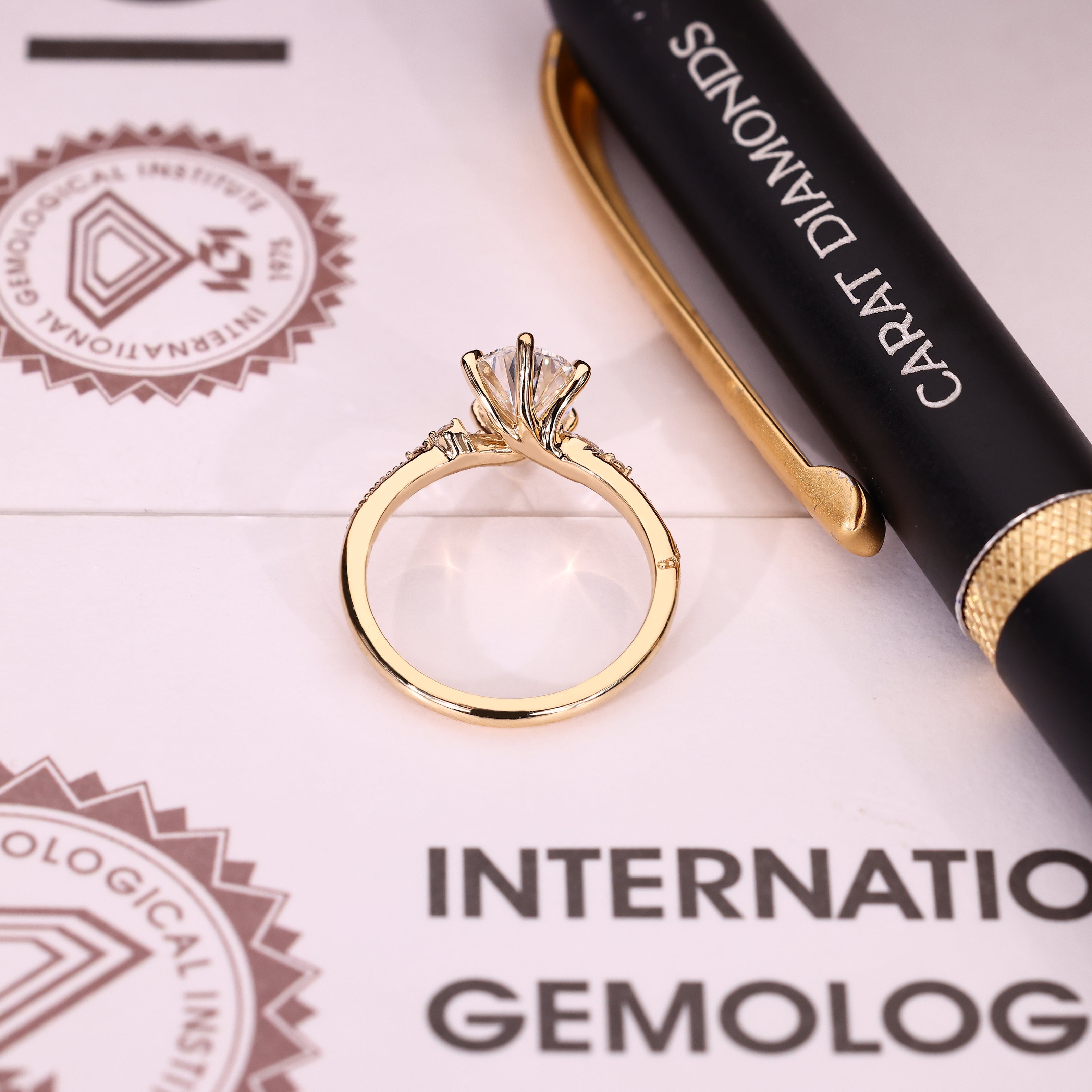IGI certified pear diamond ring with side stone accents
