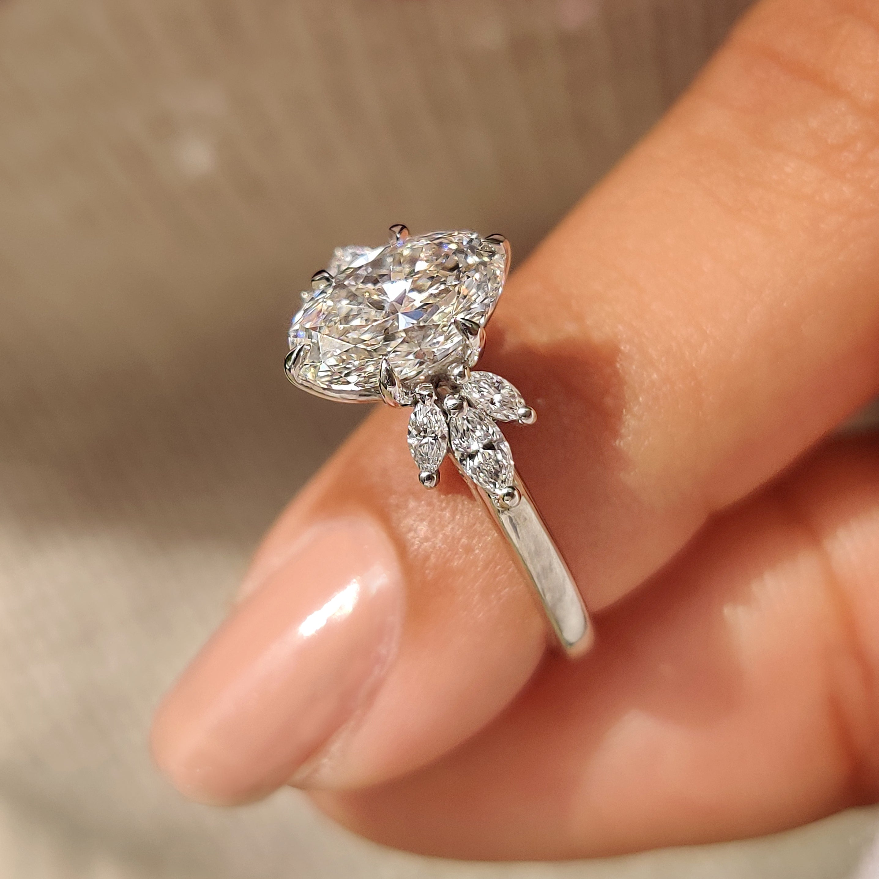 Handmade oval diamond ring with muse setting details

