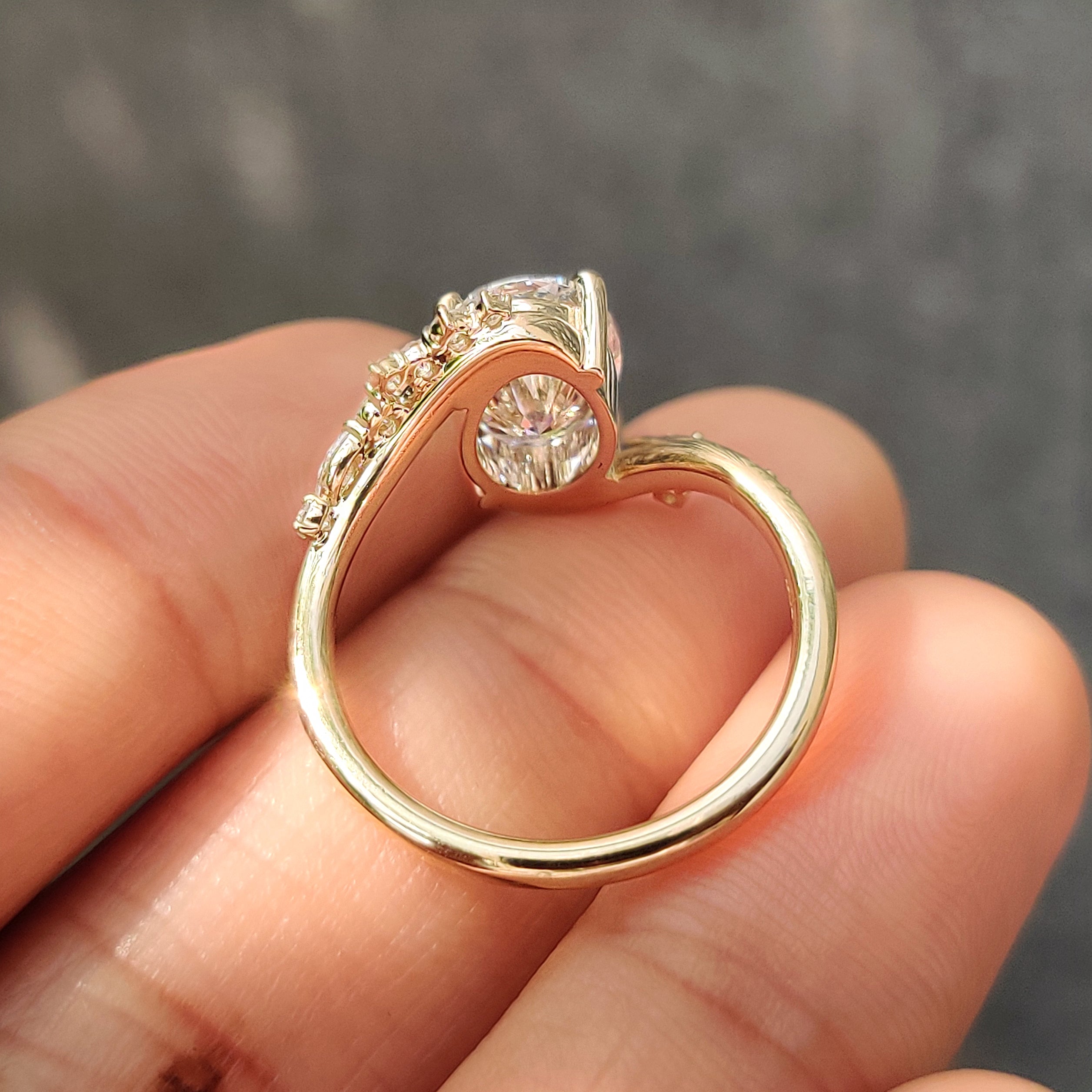 Pave style detailing across a yellow gold band.
