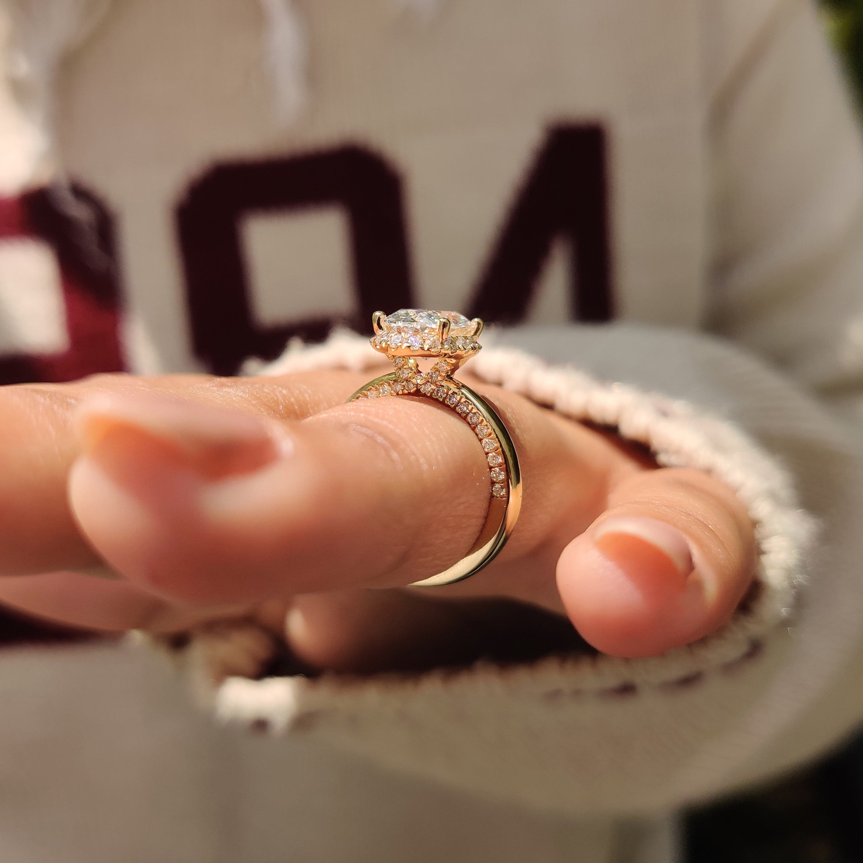 Double pave band design highlights oval diamond ring.
