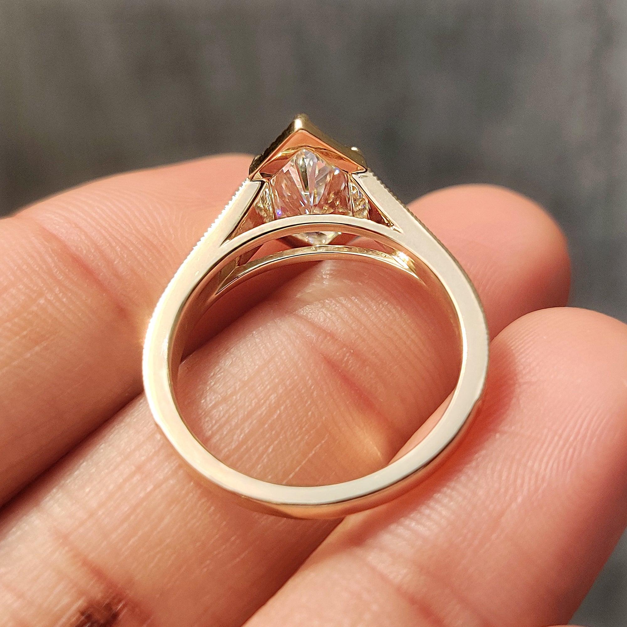 Nature inspired Dutch marquise engagement ring with leaf and floral detailing.
