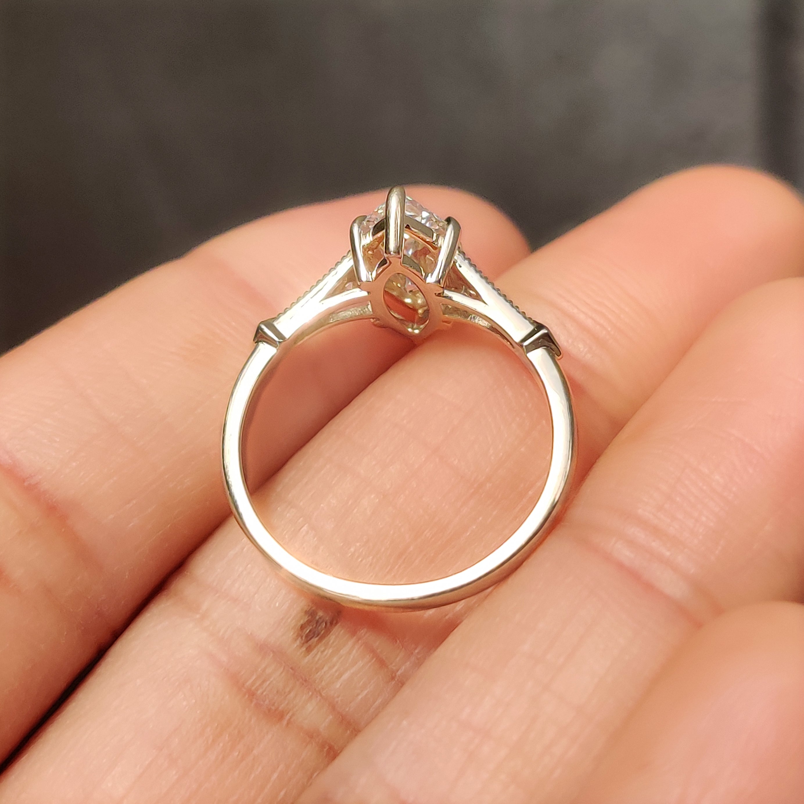 Marquise diamond ring with six prongs and milgrain edges.
