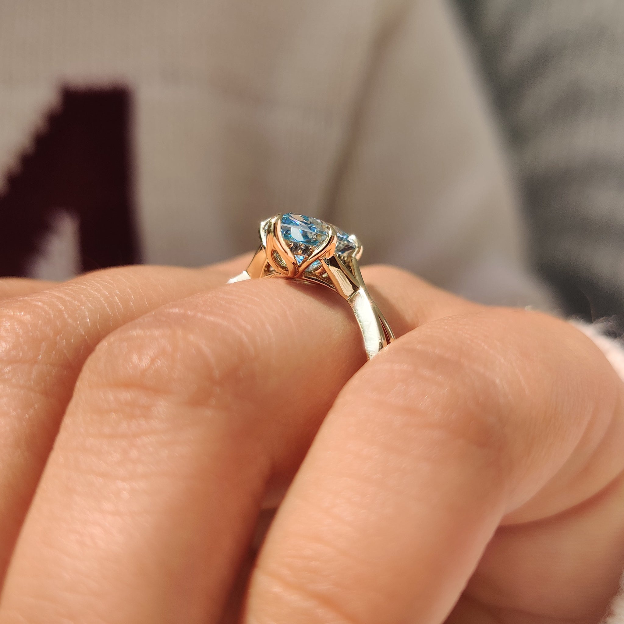 Dutch marquise aquamarine ring with round diamond hidden halo
