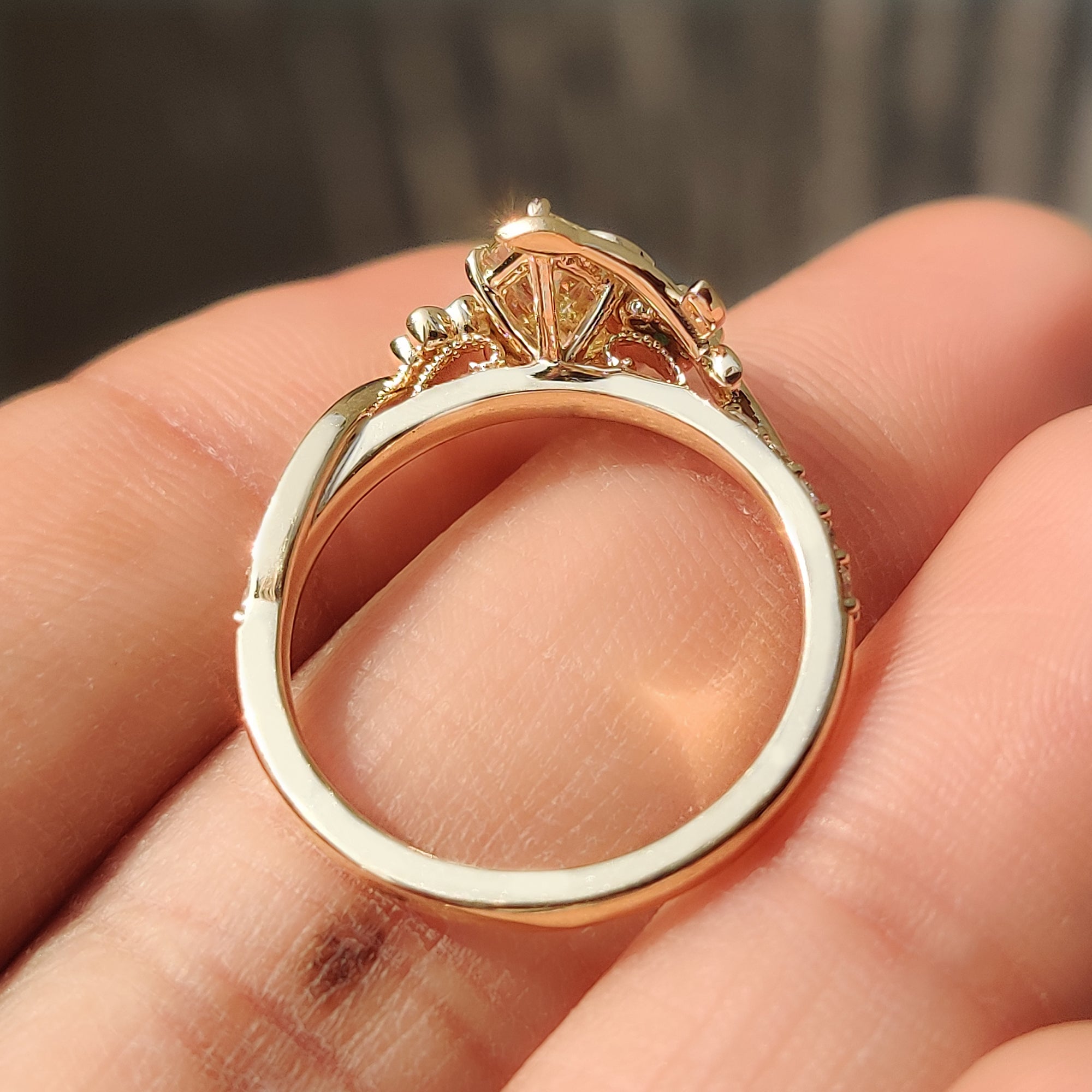 Yellow Dutch marquise nature inspired ring with green round side stones.
