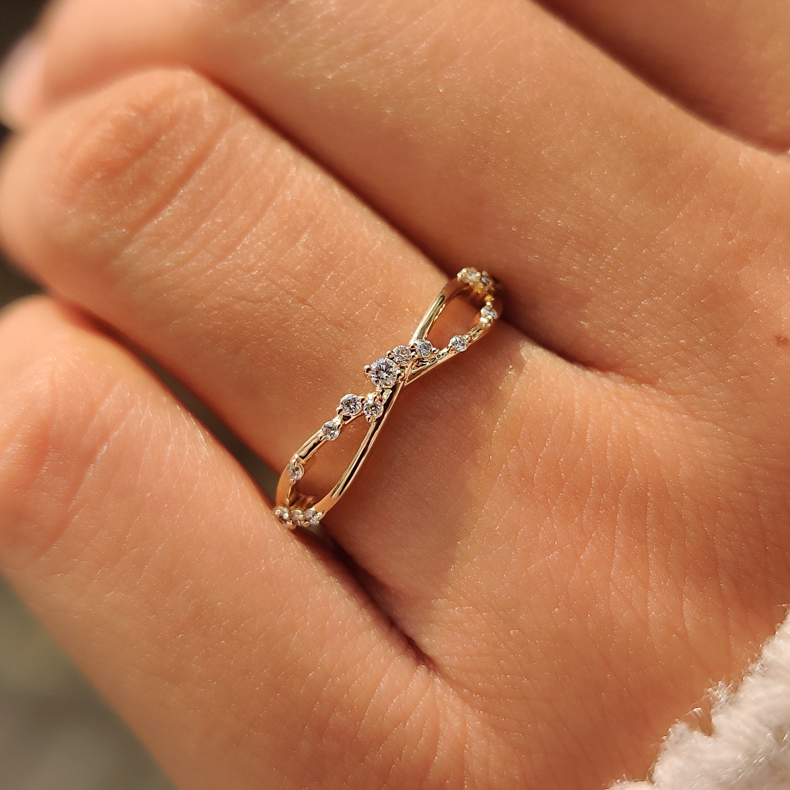 Lab grown round diamond band with twisted design.
