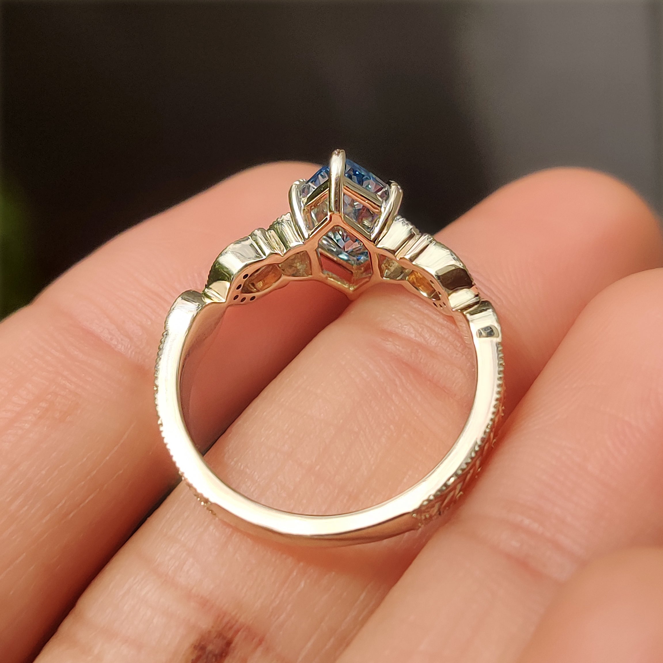 Blue Dutch marquise ring with round diamond accents
