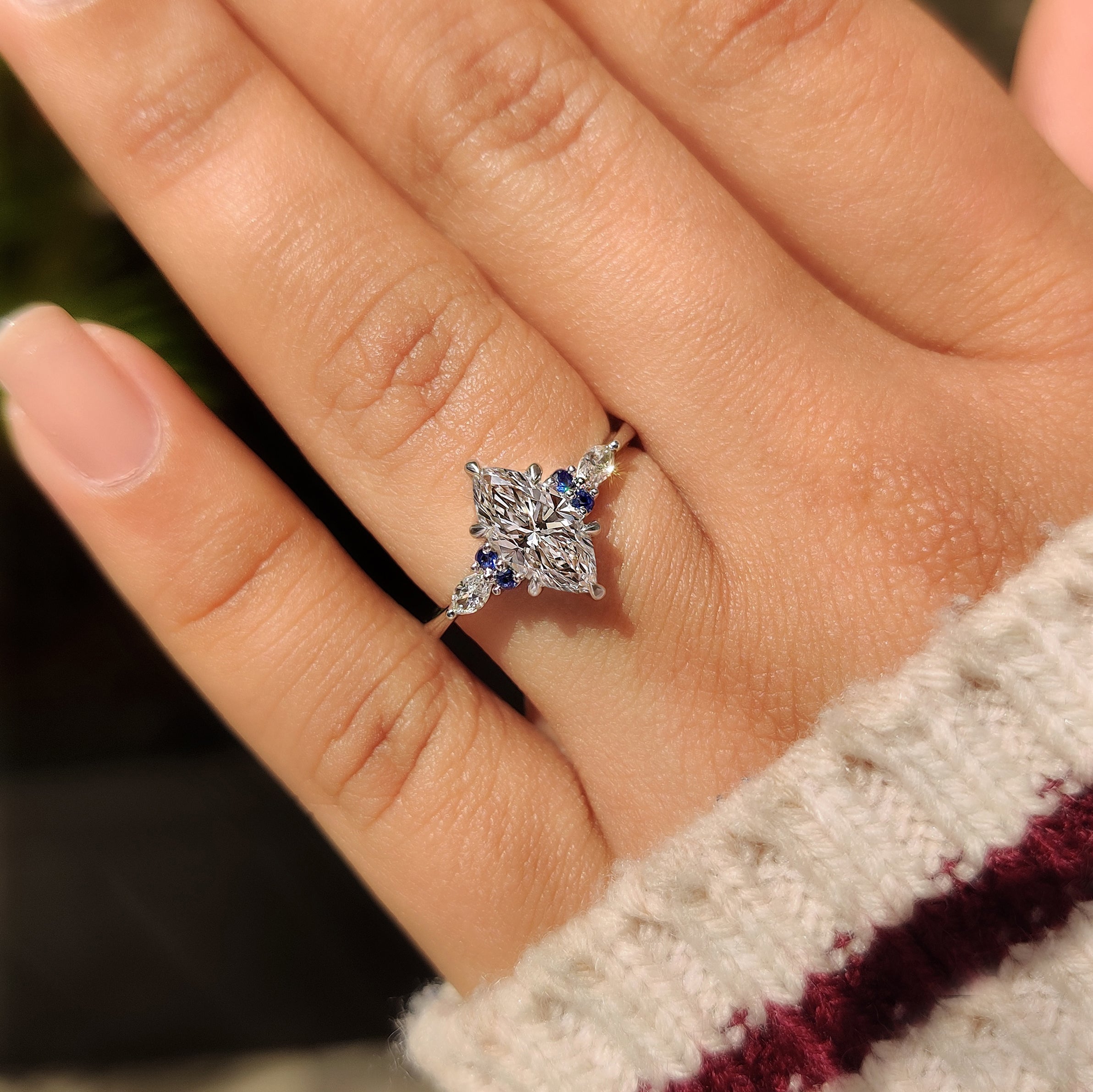 Carat Diamond marquise ring with blue sapphire side stones
