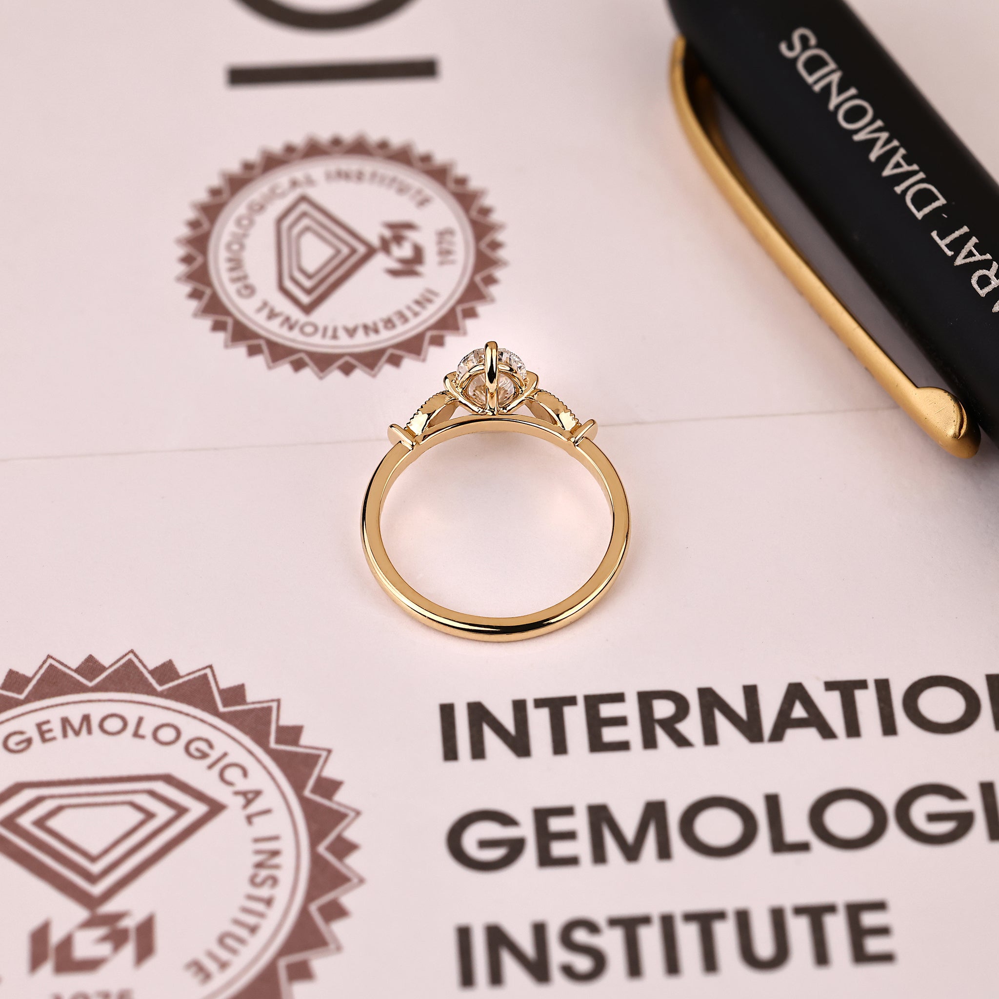 IGI certified oval diamond ring with compass claw prongs
