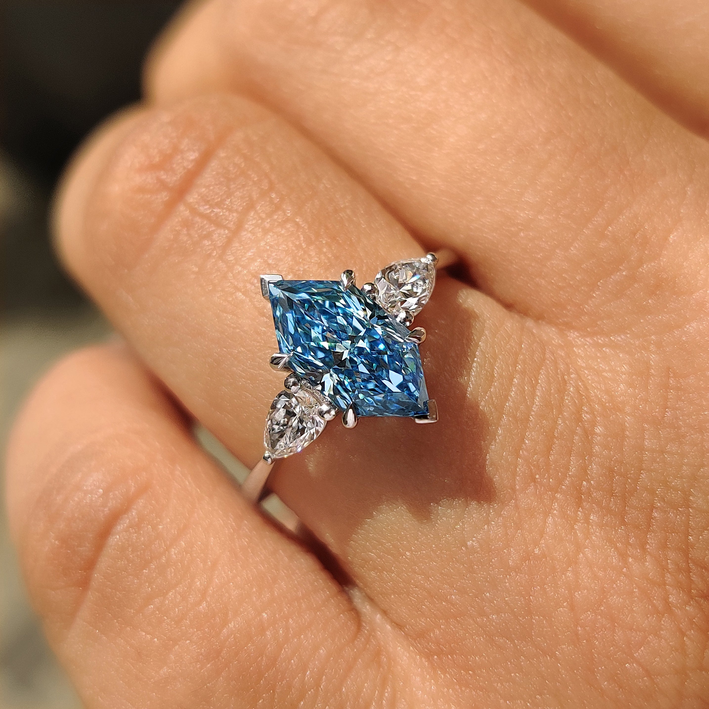 Handmade three stone ring with basket and cathedral setting
