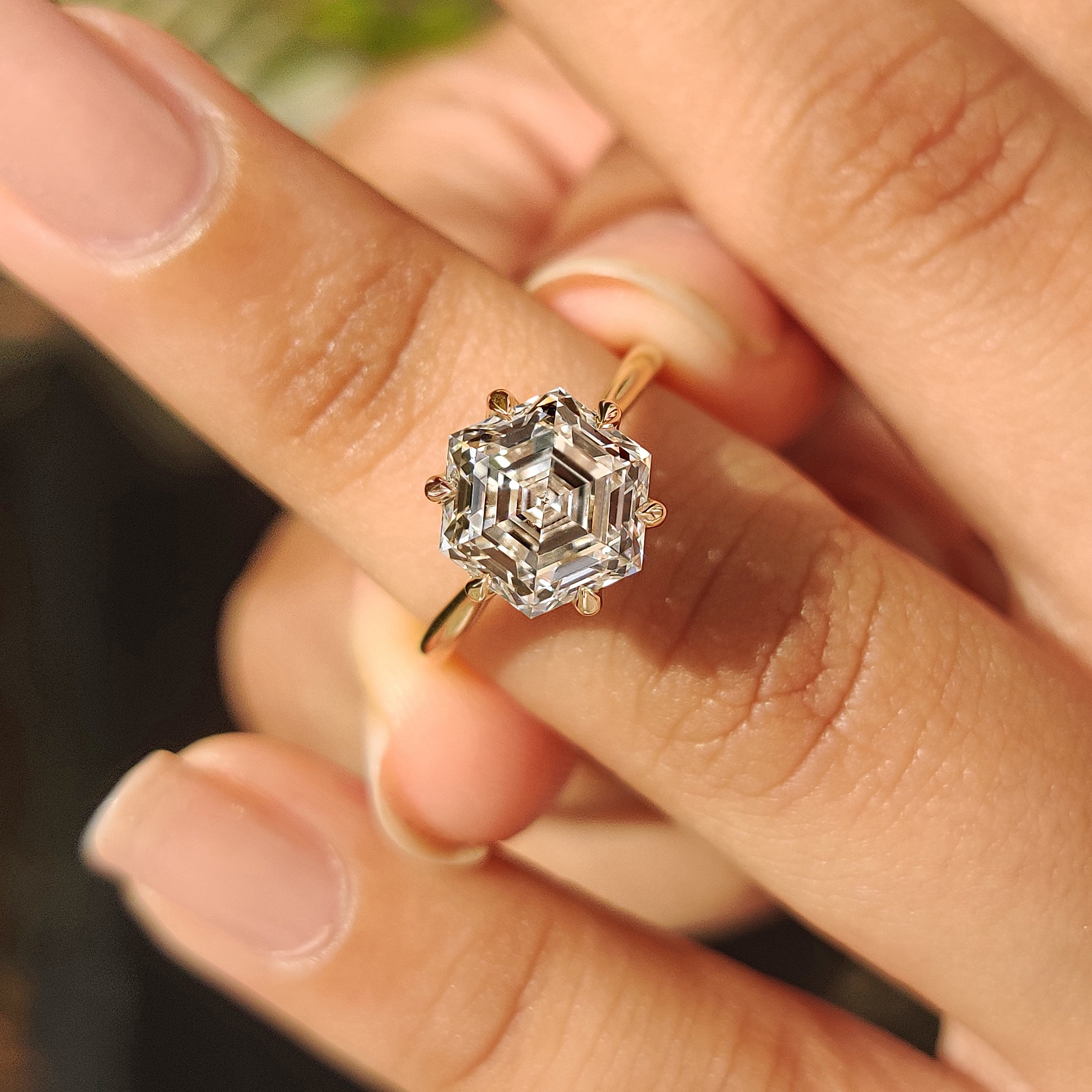 Carat Diamond hexagon ring with cathedral setting and claws

