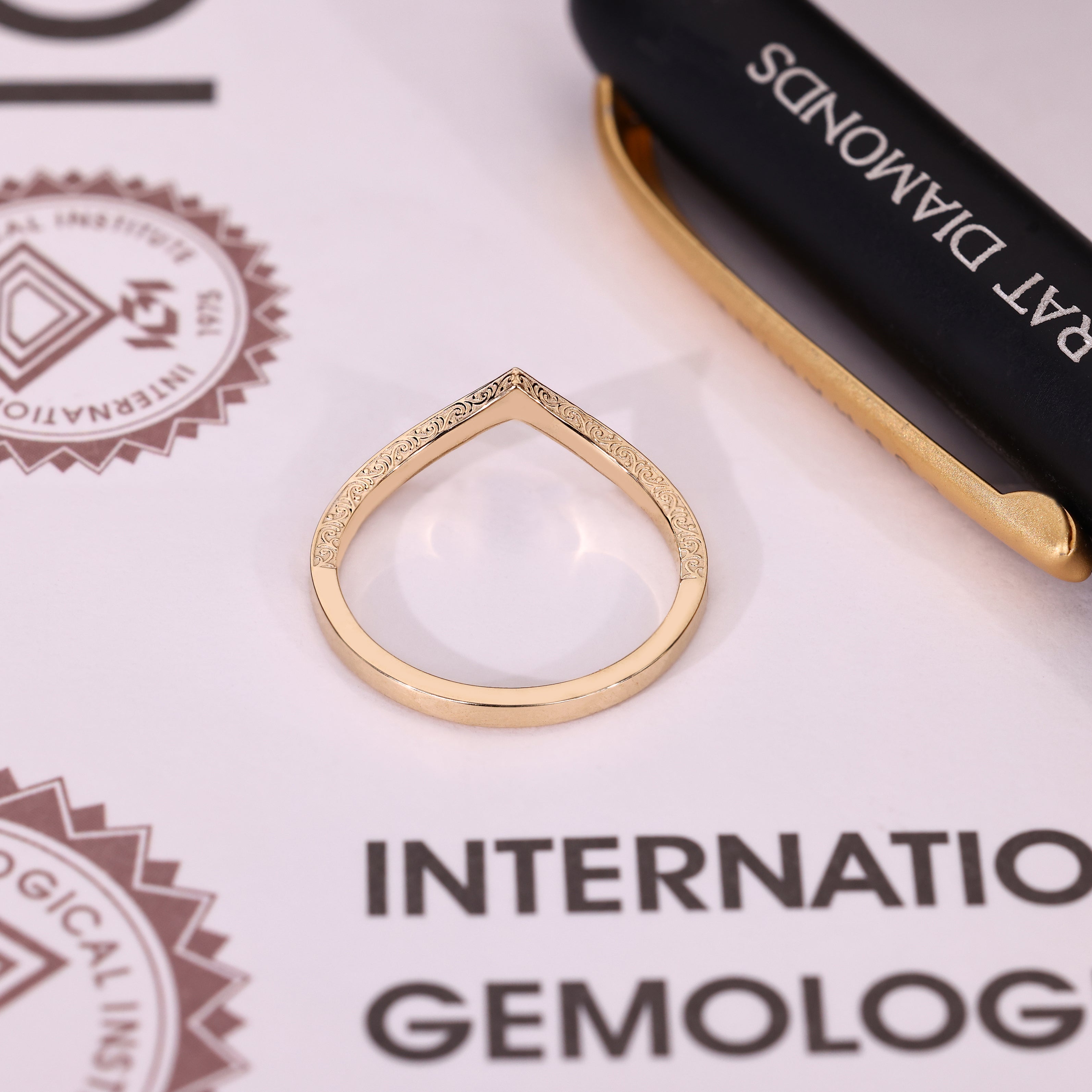 IGI certified marquise ring with split shank design details
