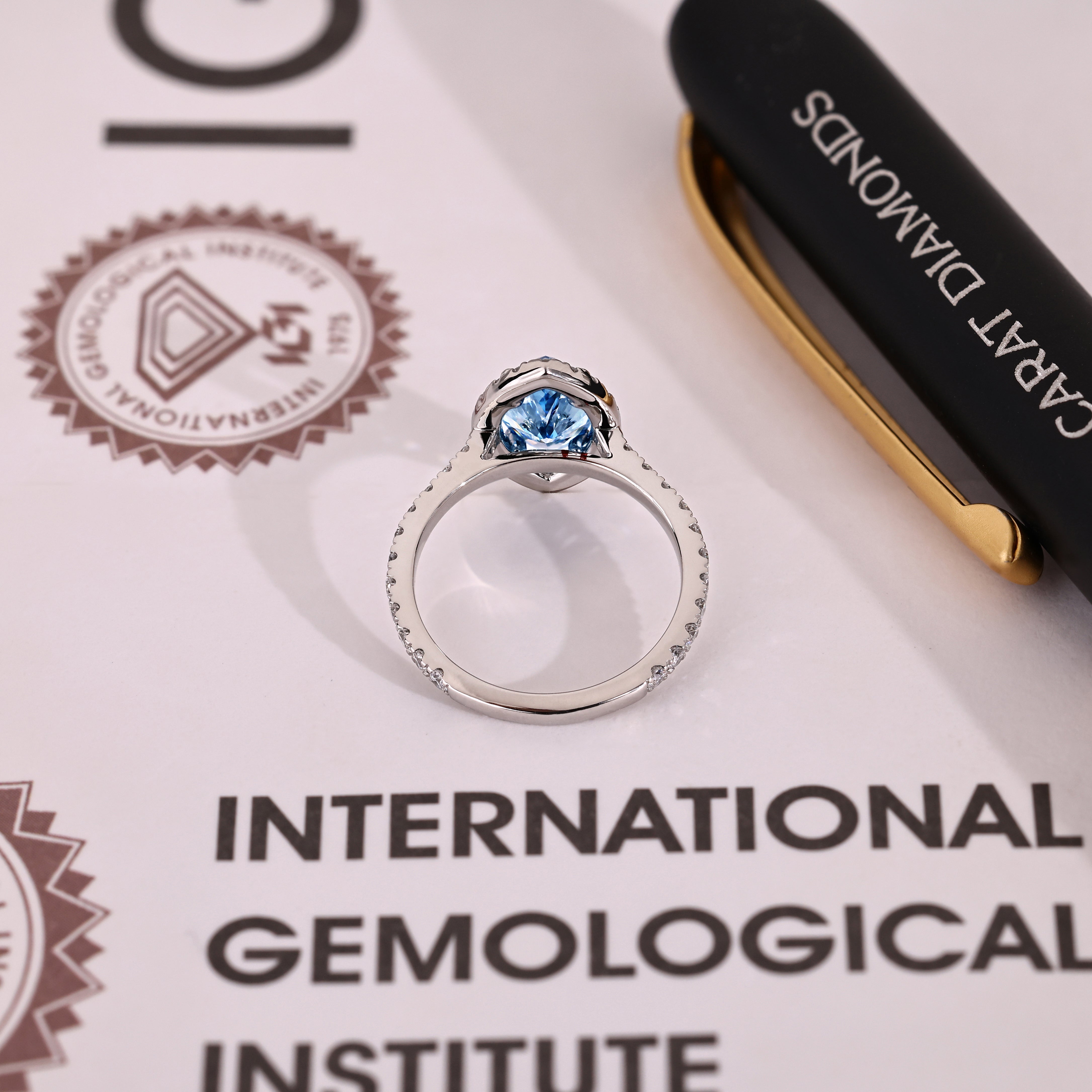 IGI certified marquise ring with blue center diamond design
