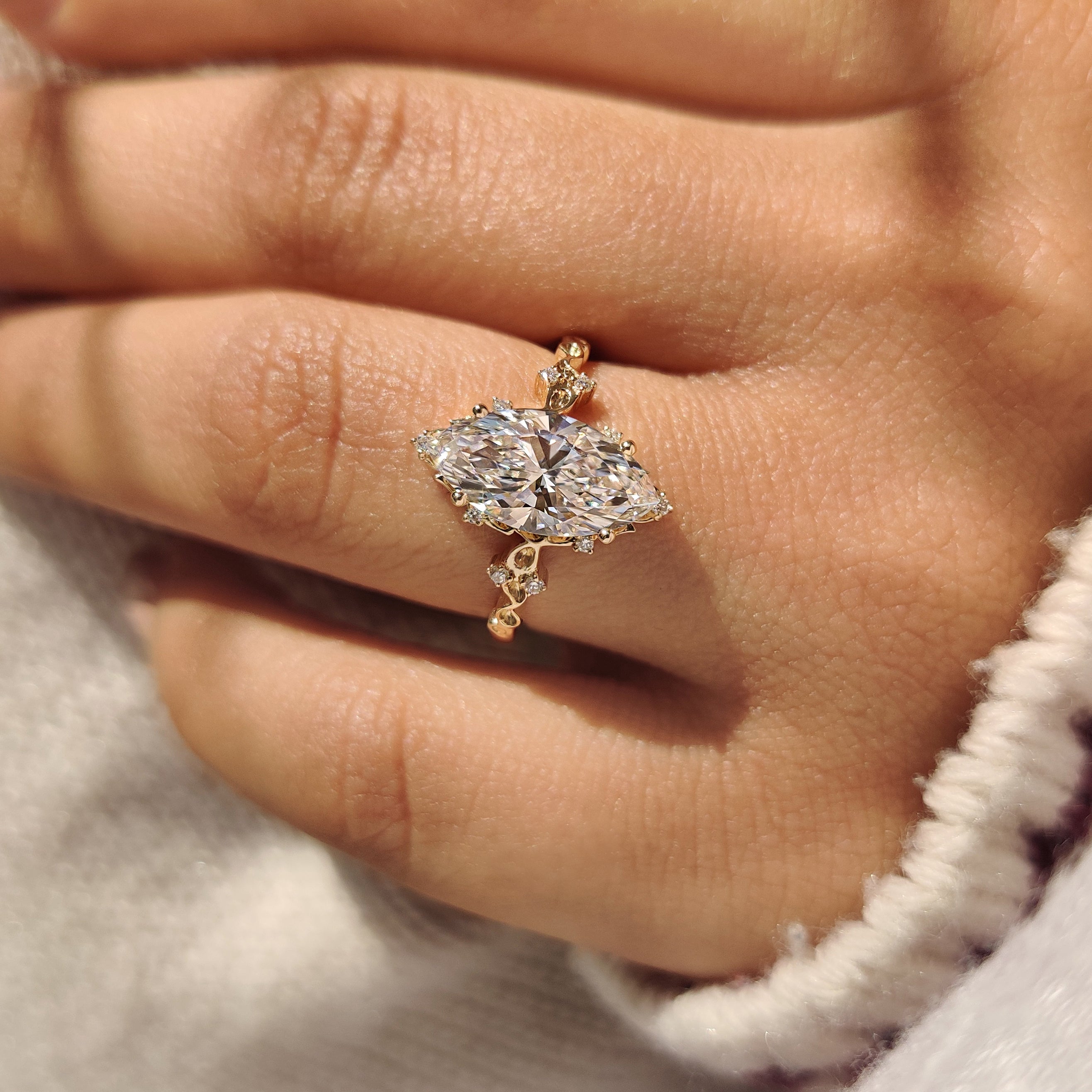 Lab grown marquise diamond ring with vintage style design.
